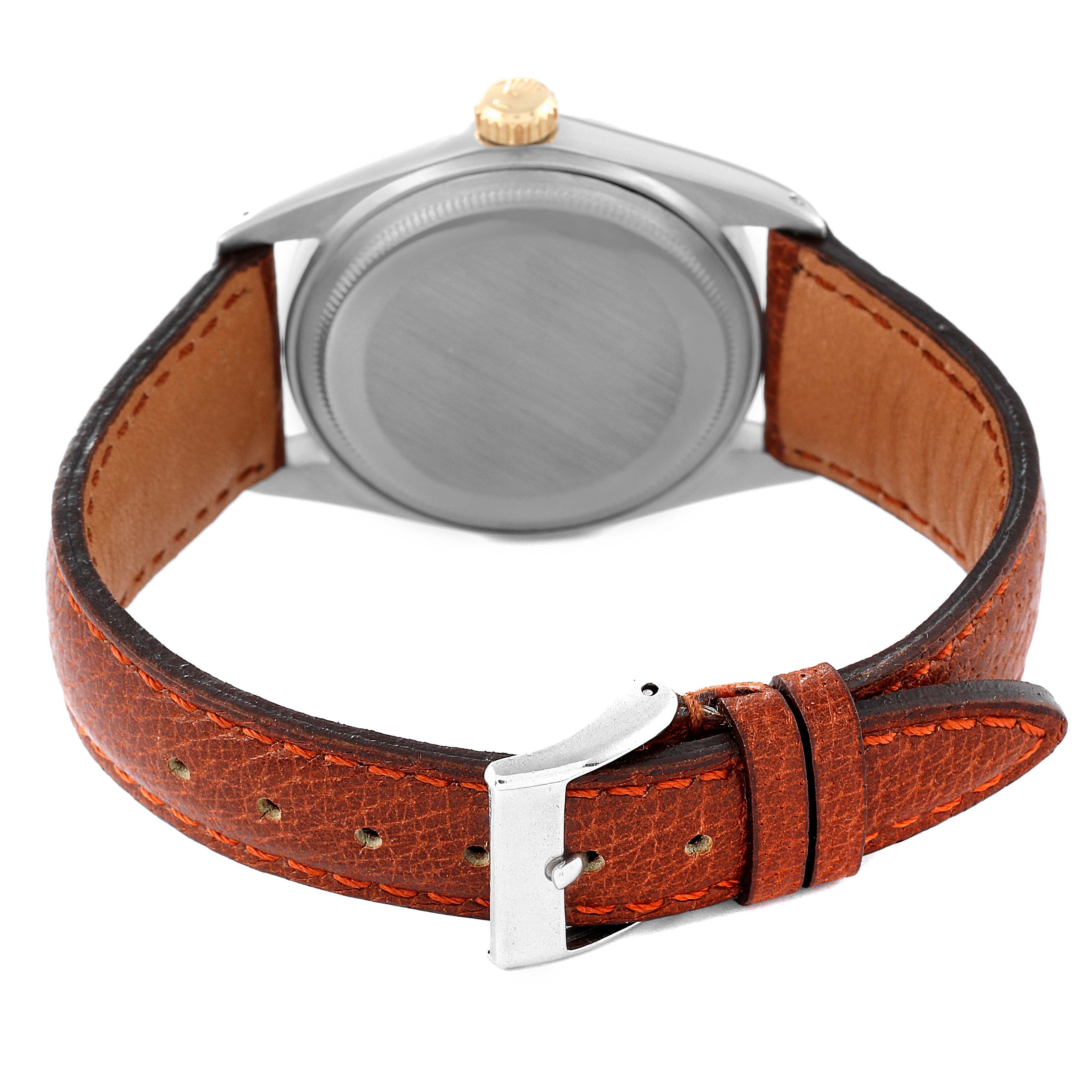 This image shows the back view of a Rolex Vintage Collection 1601 Men's Steel and Gold (two tone) Silver Dial 1601 Men's Steel and Gold (two tone) Silver Dial watch with a brown leather strap and a silver buckle.