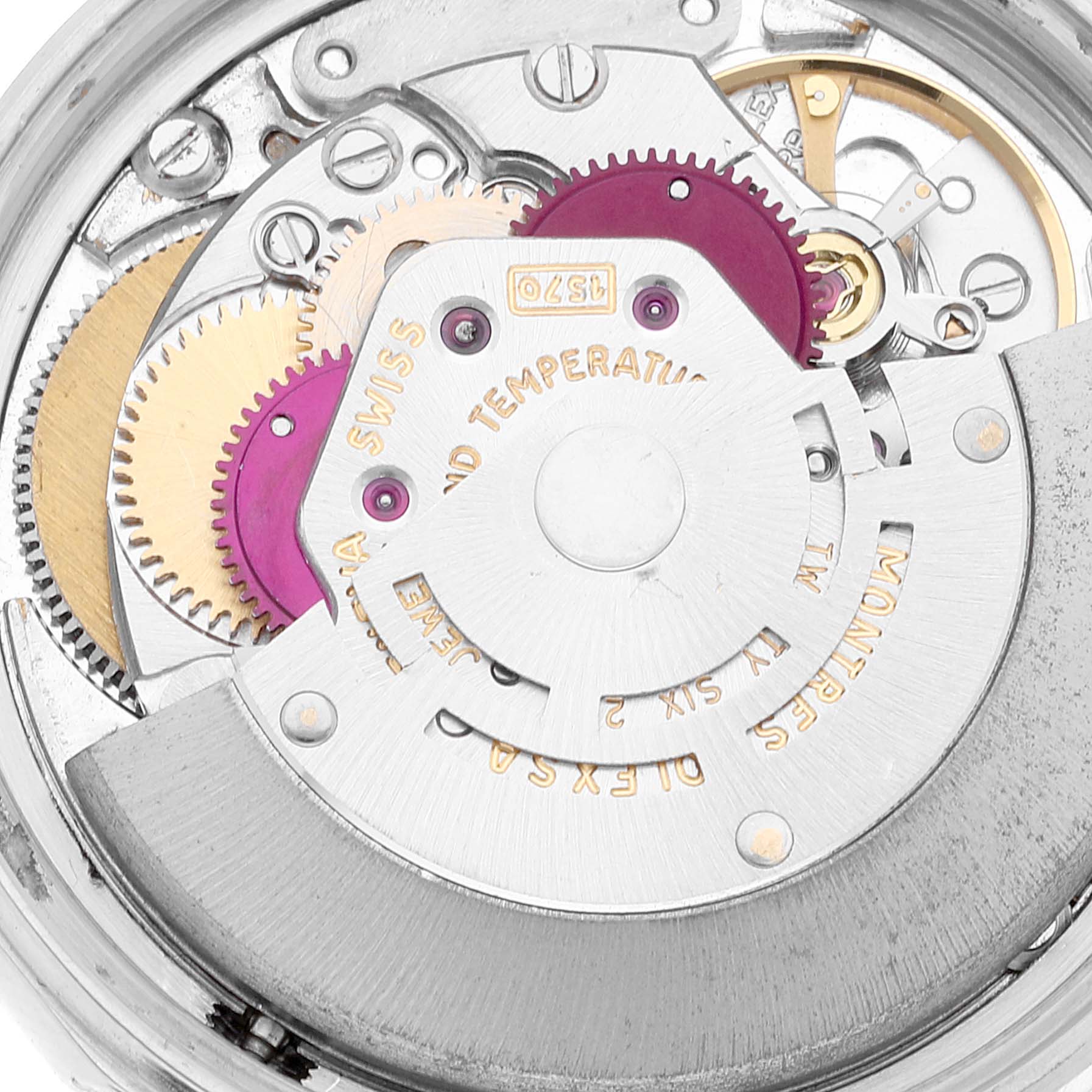 This image shows a close-up of the internal mechanism of the Vintage Collection model by Rolex, including gears and rotors.