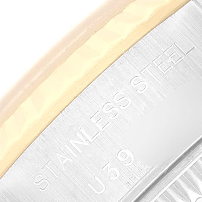 This image shows a close-up of the engravings on the stainless steel case and bezel of a Rolex Datejust 69173 Women's Steel and Gold (two tone) White Dial 69173 Women's Steel and Gold (two tone) White Dial watch.