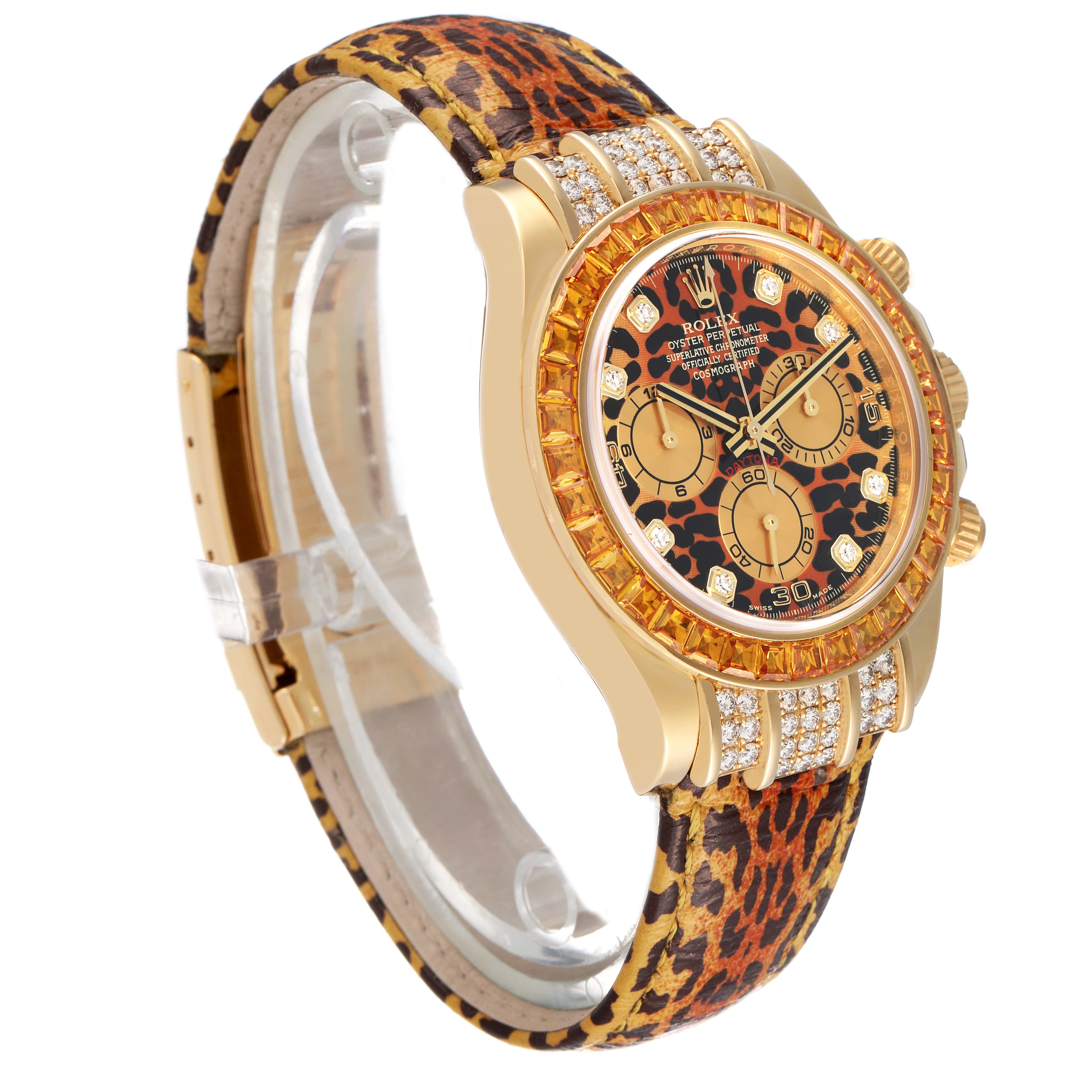 The Rolex Daytona 116598 Men's Yellow Gold Orange Dial watch is shown at an angle highlighting the face, bezel, leopard print strap, and side detailing with diamonds.