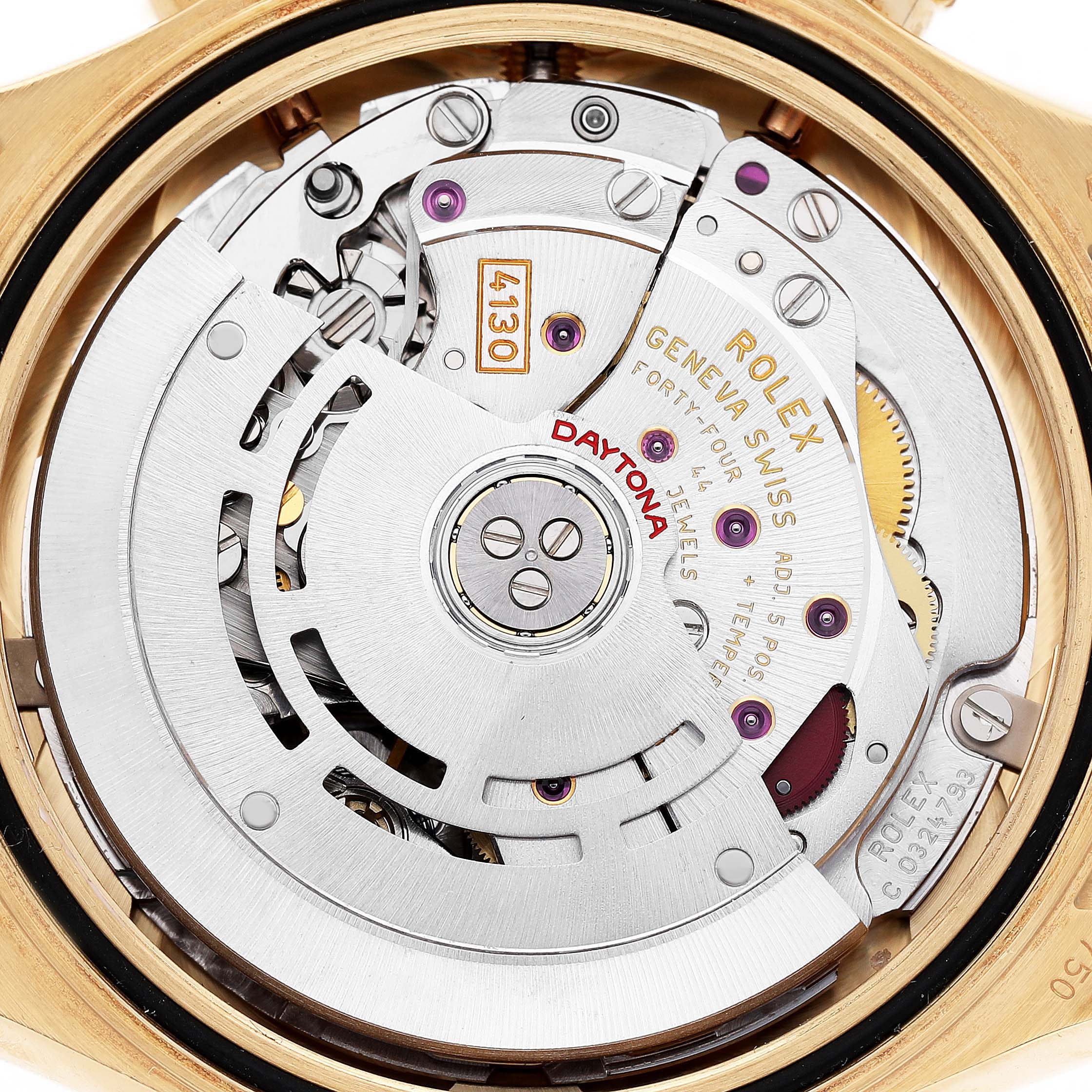 The image shows the intricate movement and rotor of a Rolex Daytona 116598 Men's Yellow Gold Orange Dial watch from a rear angle, highlighting the 4130 caliber.