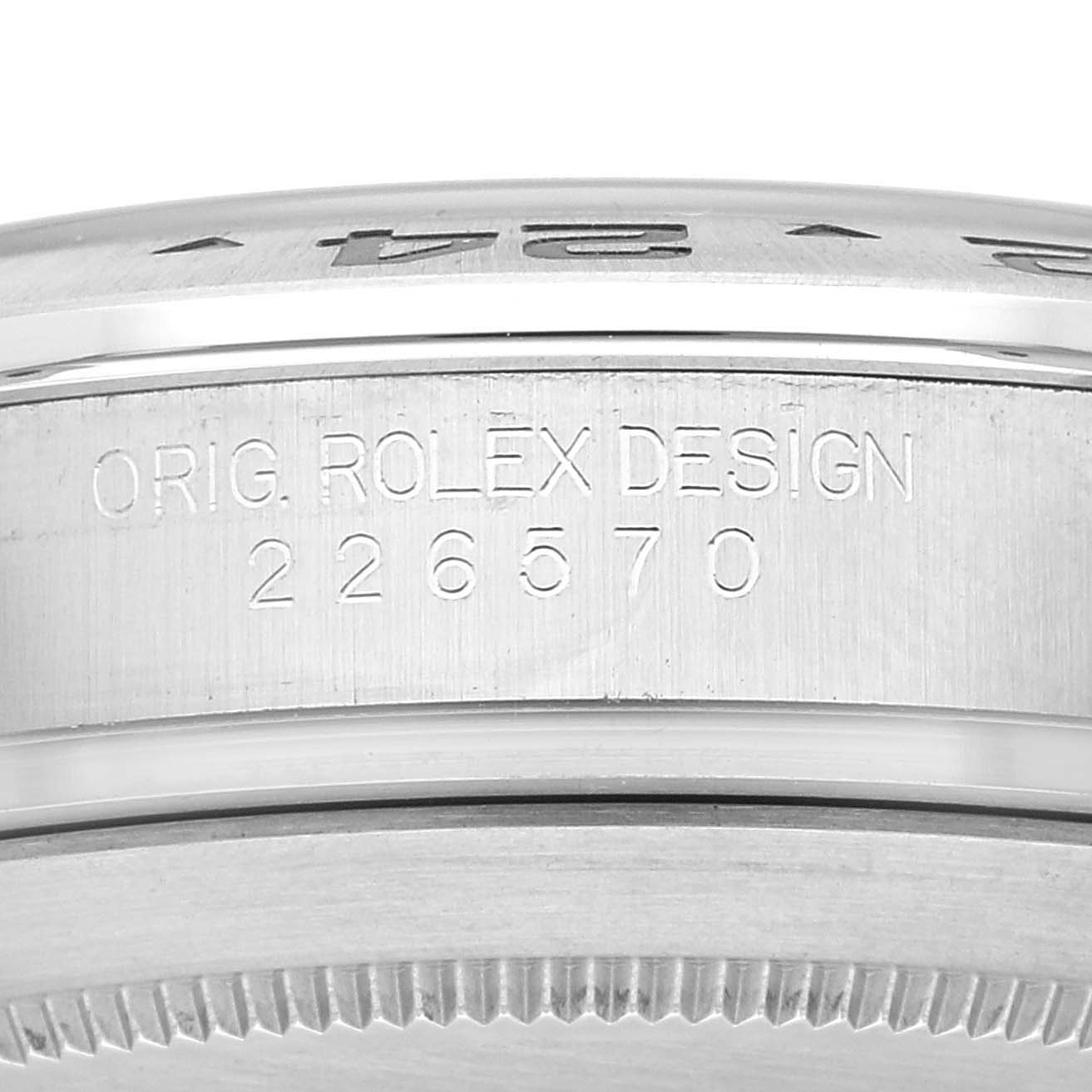 The image shows a close-up of the side of a Rolex Explorer 226570 Men's Stainless Steel White Dial 226570 Men's Stainless Steel White Dial watch case, displaying the model number "226570" and "ORIG. ROLEX DESIGN" engraving.