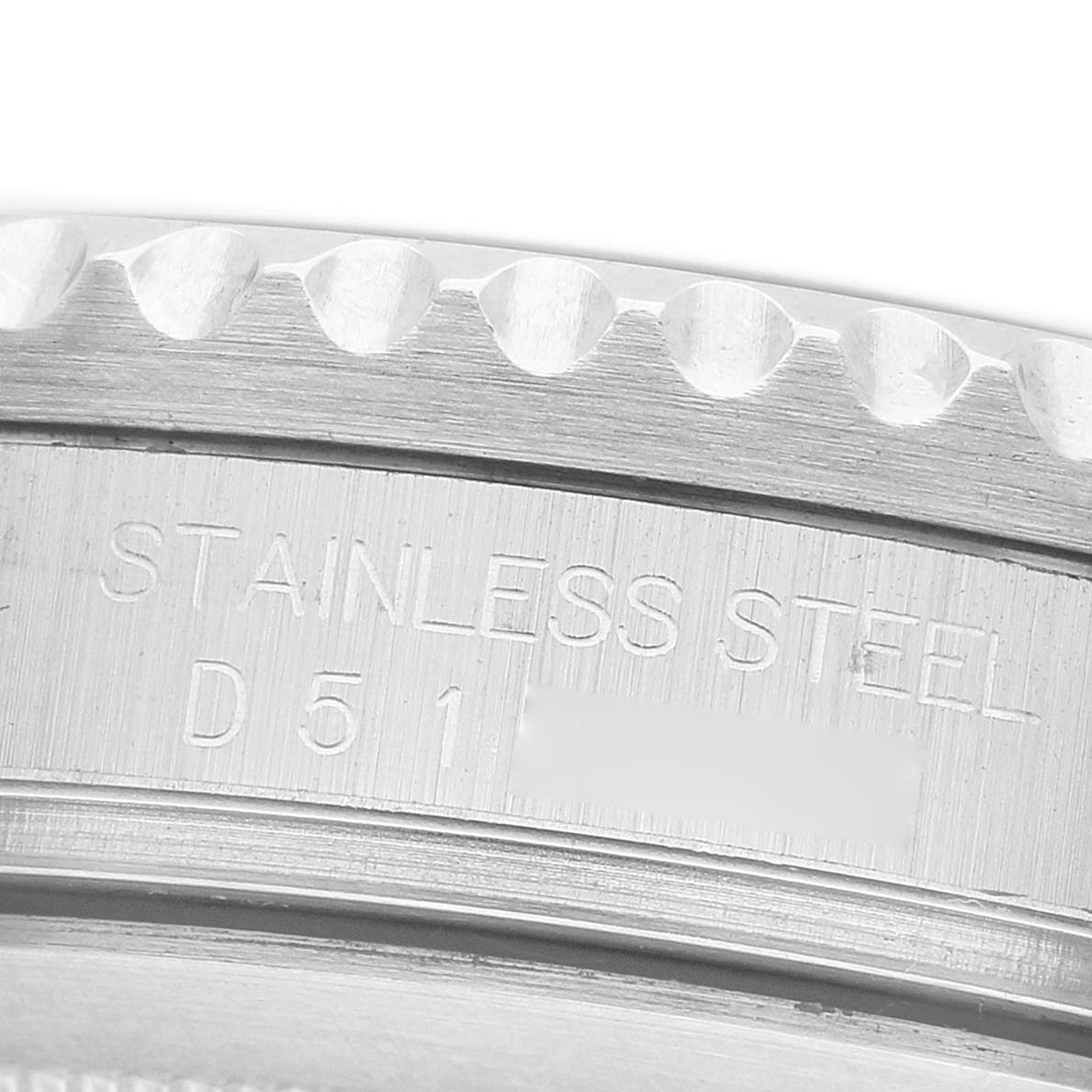 The image shows a close-up of the bezel and case edge of a Rolex GMT-Master 16710 Men's Stainless Steel Black Dial, highlighting the "STAINLESS STEEL" engraving.