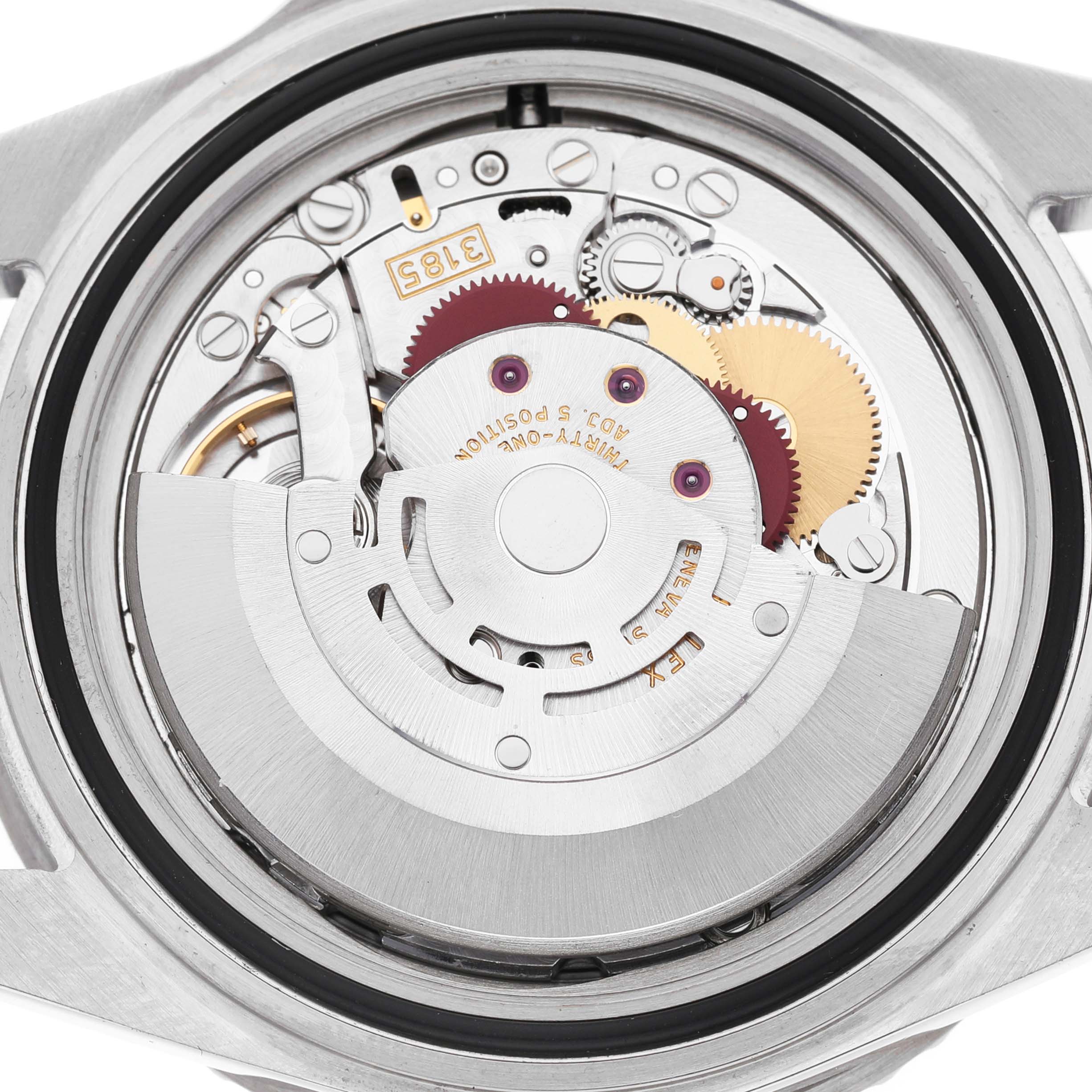 The image shows a close-up of the movement inside a Rolex GMT-Master 16710 Men's Stainless Steel Black Dial, focusing on the gears and rotor.