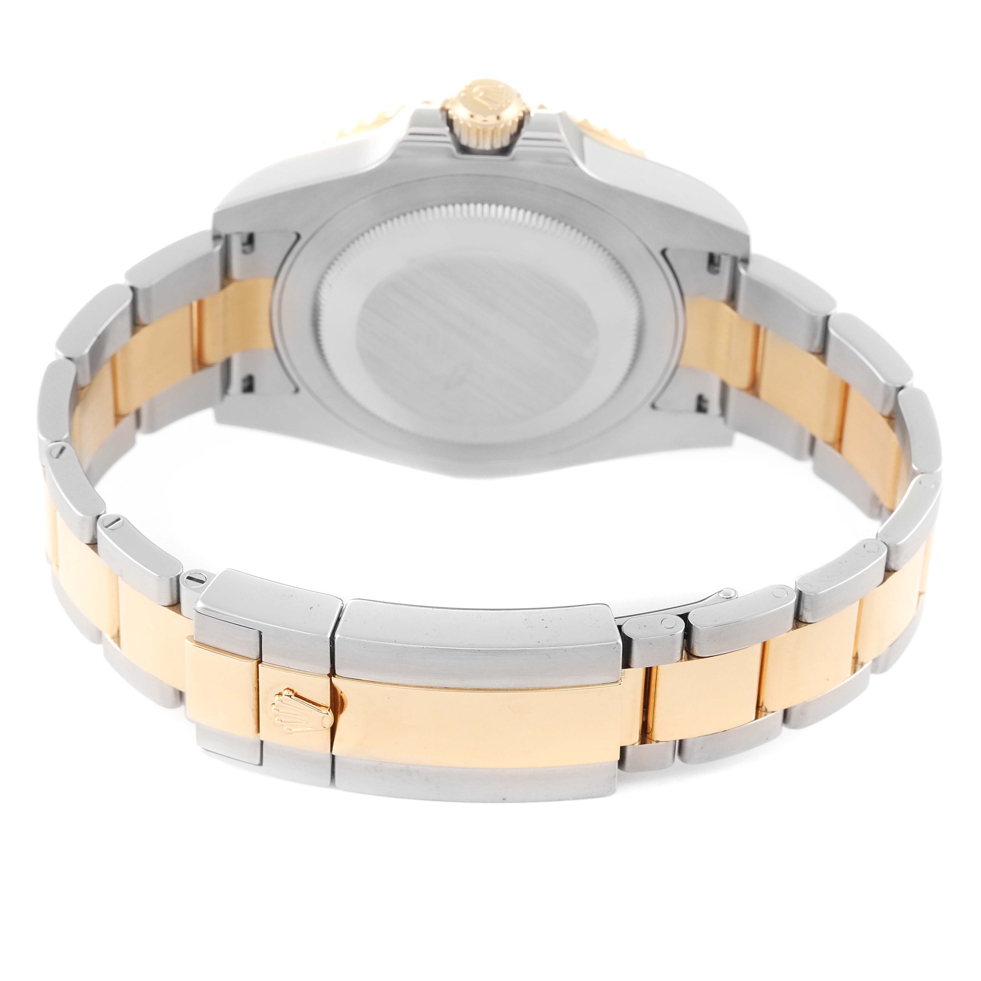 This image shows the back case and bracelet of a Rolex GMT-Master 116713 Men's Steel and Gold (two tone) Black Dial 116713 Men's Steel and Gold (two tone) Black Dial watch, emphasizing its two-tone (silver and gold) design.