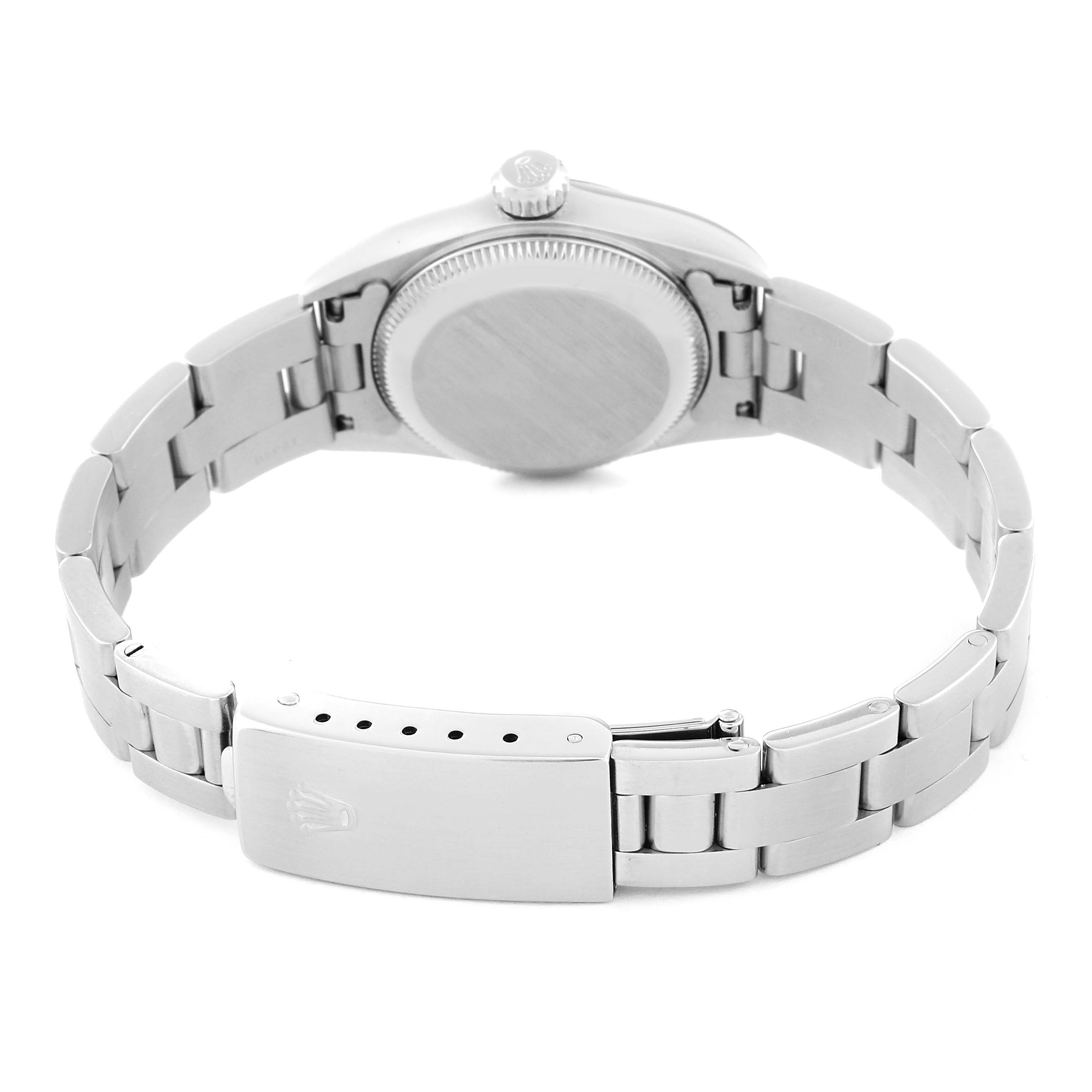 The image shows the Rolex Oyster Perpetual 67180 Women
s Stainless Steel Pink Dial 67180 Women
s Stainless Steel Pink Dial watch from a rear angle, highlighting the case back, bracelet, and clasp.