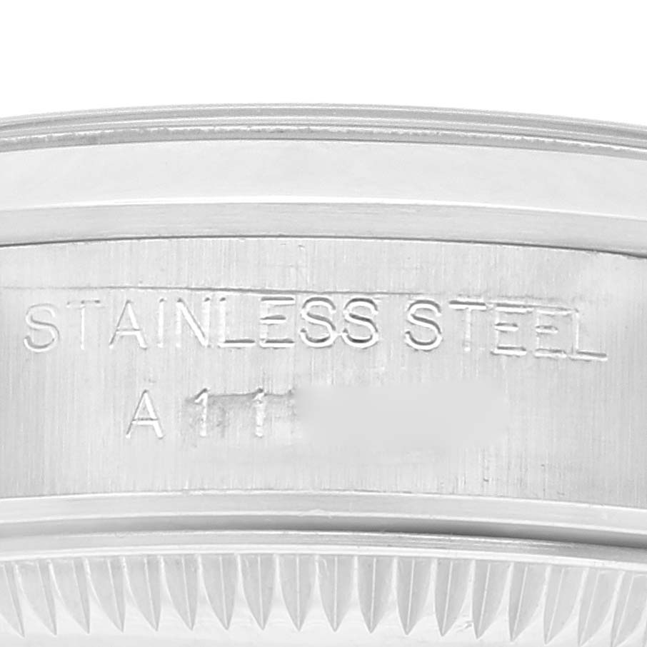 This image shows a close-up of the stainless steel case side with the engraving of a Rolex Oyster Perpetual 67180 Women
s Stainless Steel Pink Dial 67180 Women
s Stainless Steel Pink Dial watch.