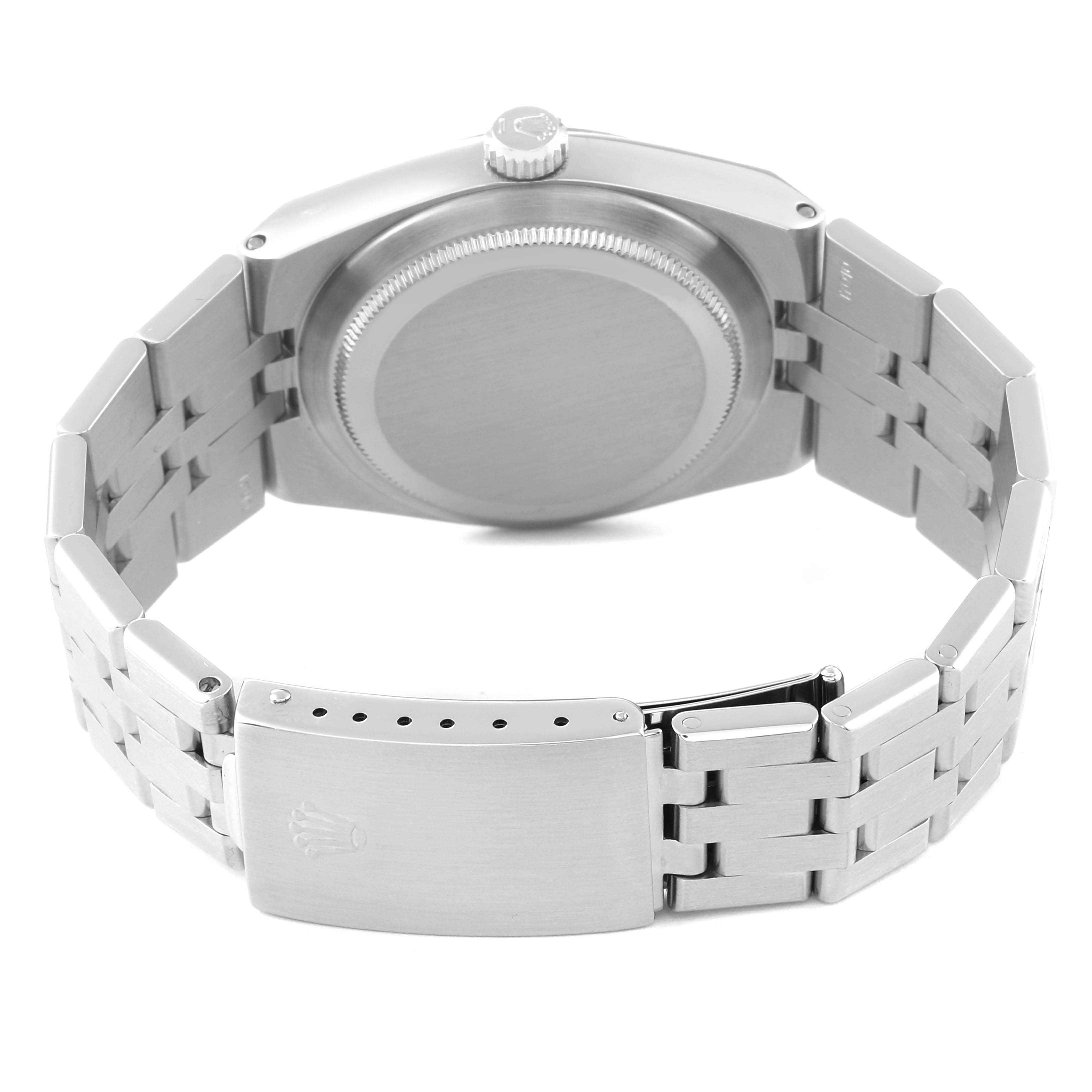 The image shows a Rolex Oysterquartz 17014 Men
s Stainless Steel Grey Dial 17014 Men
s Stainless Steel Grey Dial watch from the back, focusing on the case back, crown, and metal bracelet clasp.