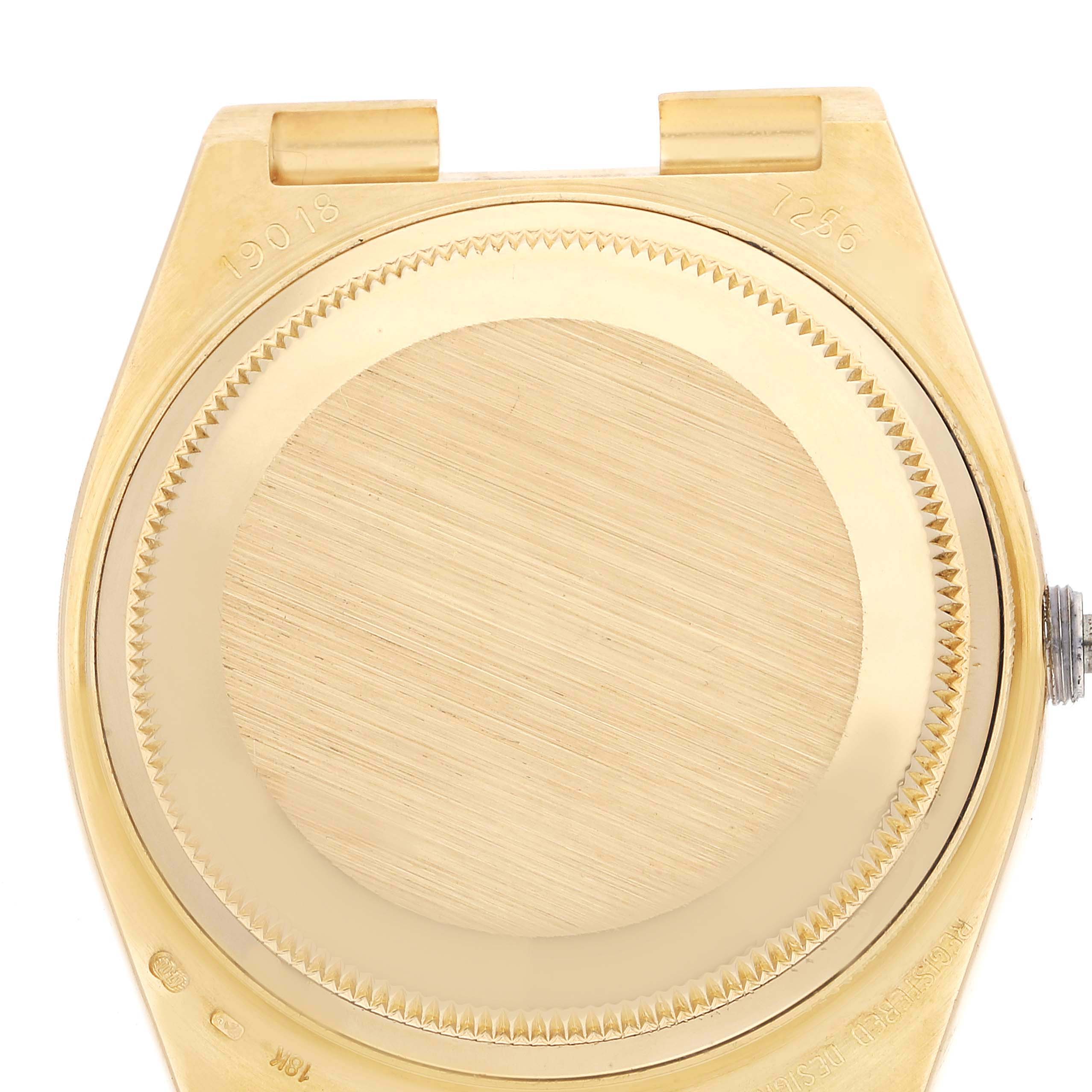 This image shows the back case of the Rolex President 19018 Men
s Yellow Gold Champagne Dial 19018 Men
s Yellow Gold Champagne Dial model watch from a top-down angle.