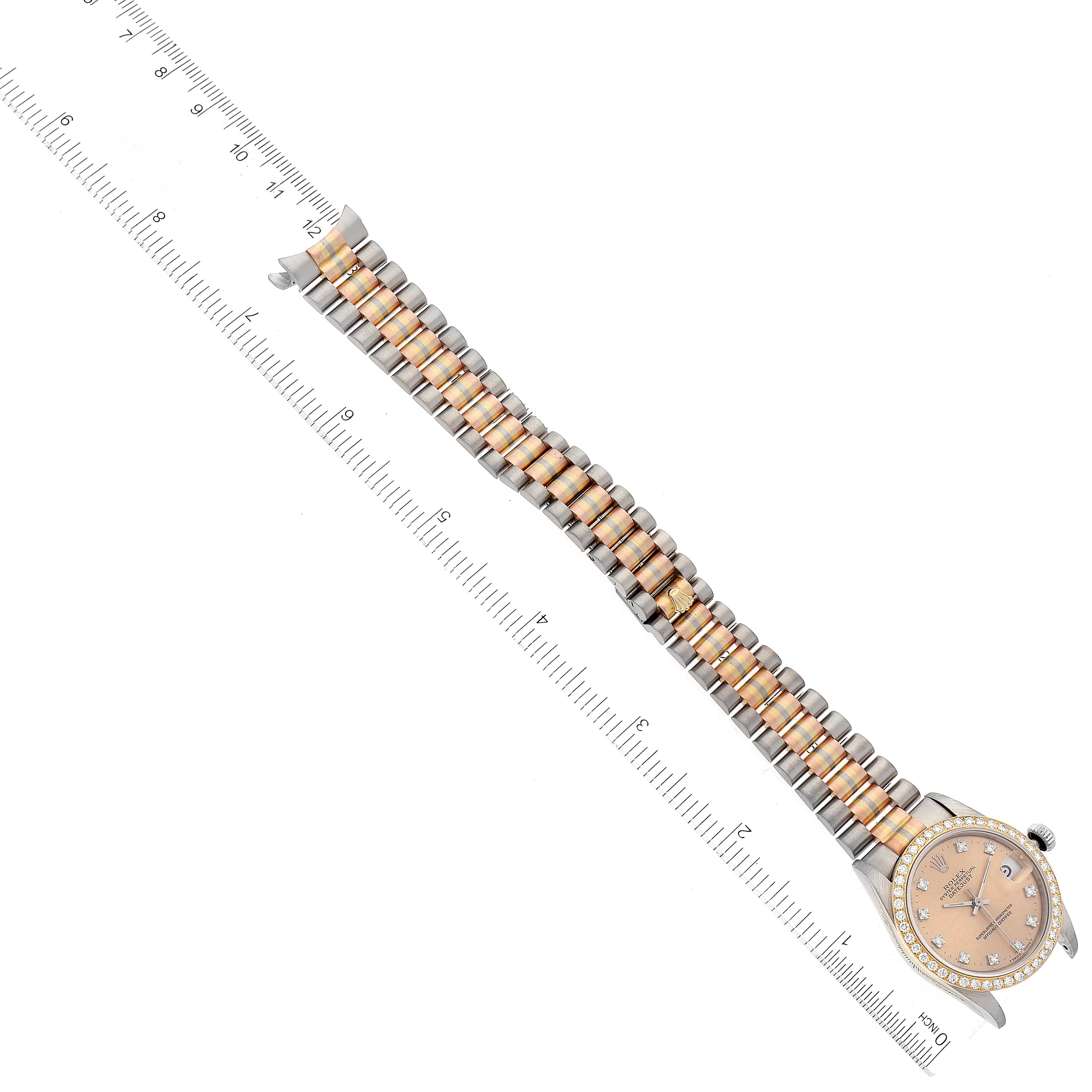 The image shows a Rolex President 68289 Women's Steel and Gold (two tone) Brown Dial 68289 Women's Steel and Gold (two tone) Brown Dial model watch fully extended next to a ruler for scale measurements.
