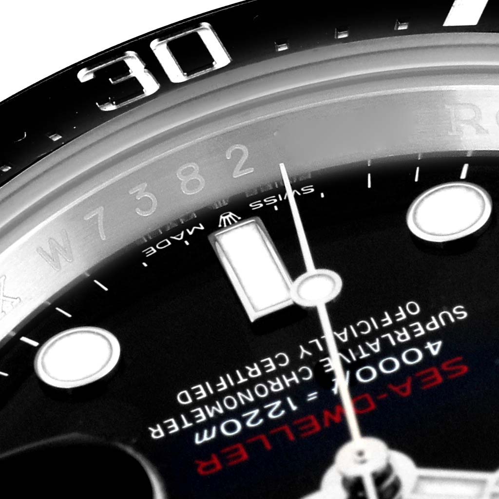 This image of the Rolex Sea-Dweller 126600 Men
s Stainless Steel Black Dial 126600 Men
s Stainless Steel Black Dial watch shows a close-up of the dial, bezel, and part of the watch face, highlighting the "SEA-DWELLER" text.