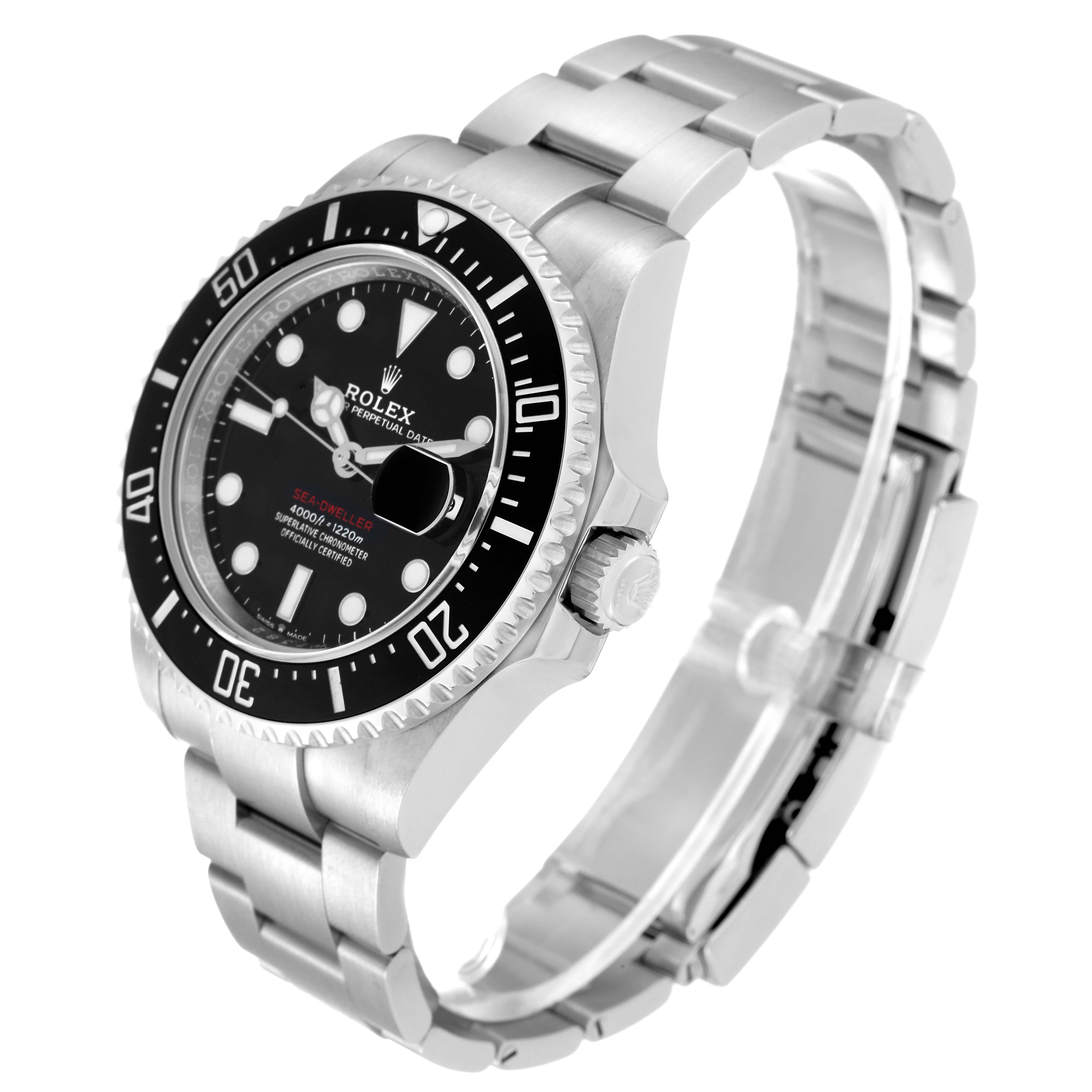 The image shows a Rolex Sea-Dweller 126600 Men
s Stainless Steel Black Dial 126600 Men
s Stainless Steel Black Dial watch seen from a three-quarter angle highlighting its face, bezel, crown, and bracelet.