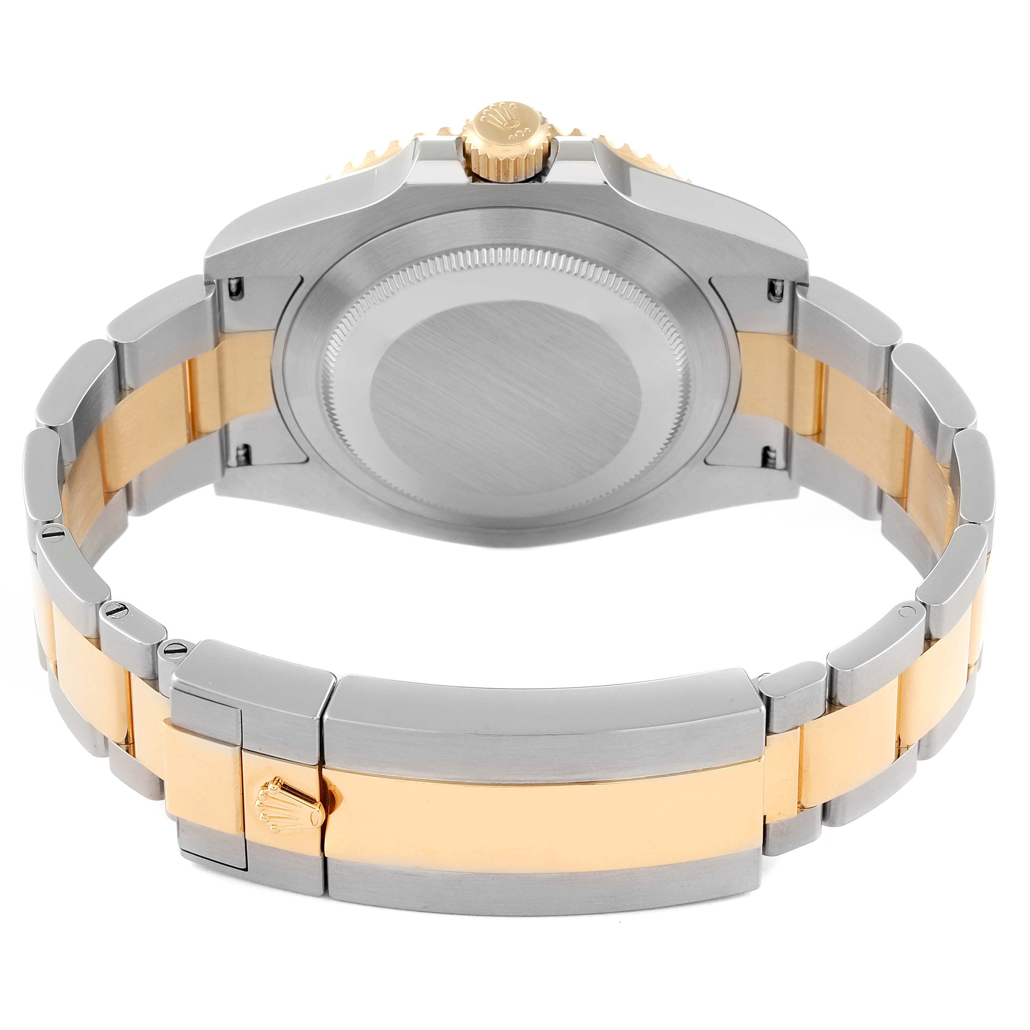 The image shows the back of a Rolex Submariner 126613LB Men
s Steel and Gold (two tone) Blue Dial 126613LB Men
s Steel and Gold (two tone) Blue Dial watch, highlighting its case back, crown, and two-tone bracelet.