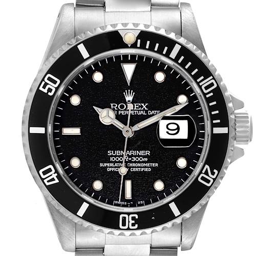 The image shows a front view of a Rolex Submariner, displaying its black bezel, dial, luminescent markers, and date magnifier.