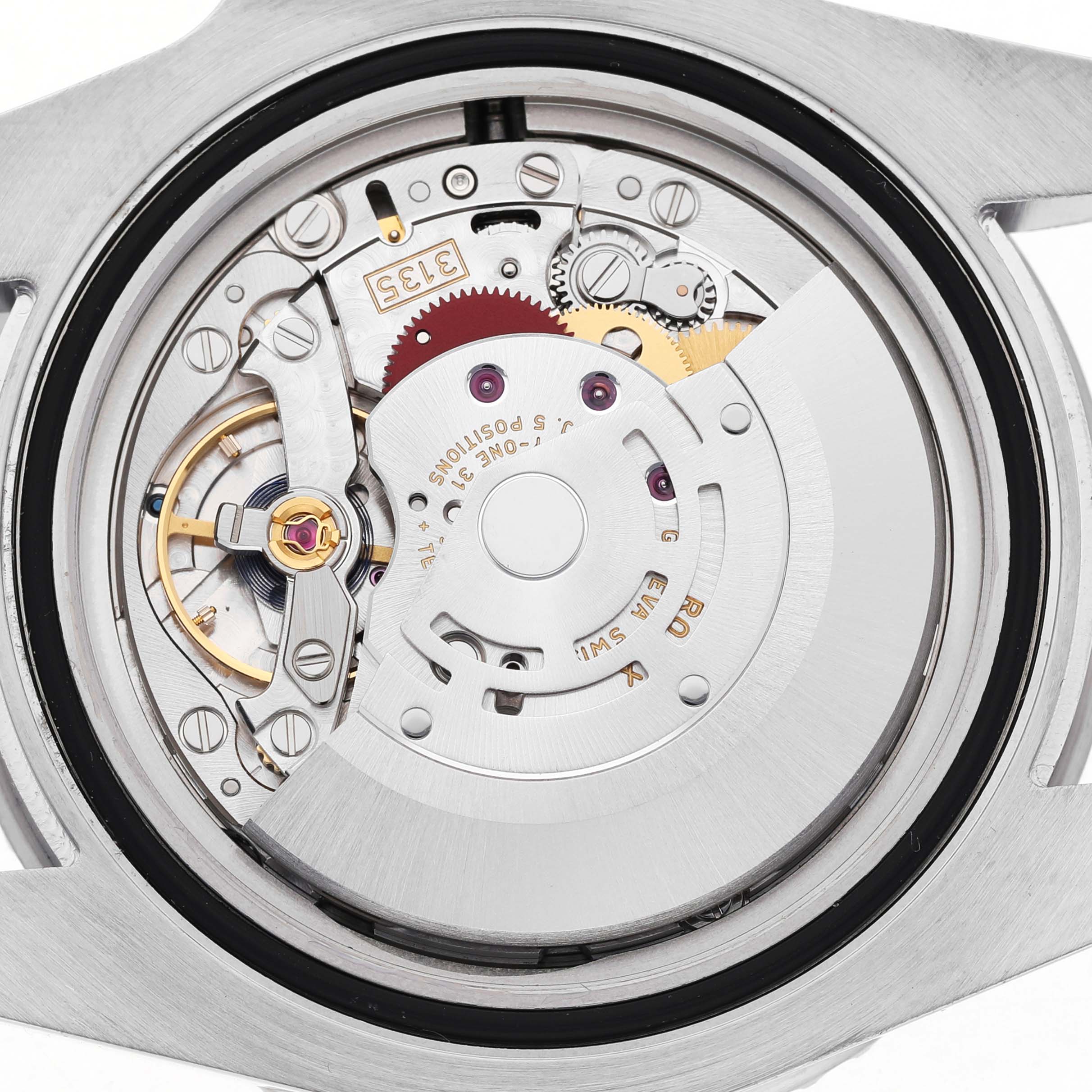 The image shows the Rolex Submariner 116610LV Men's Stainless Steel Green Dial's movement from a back angle, highlighting gears and the rotor.