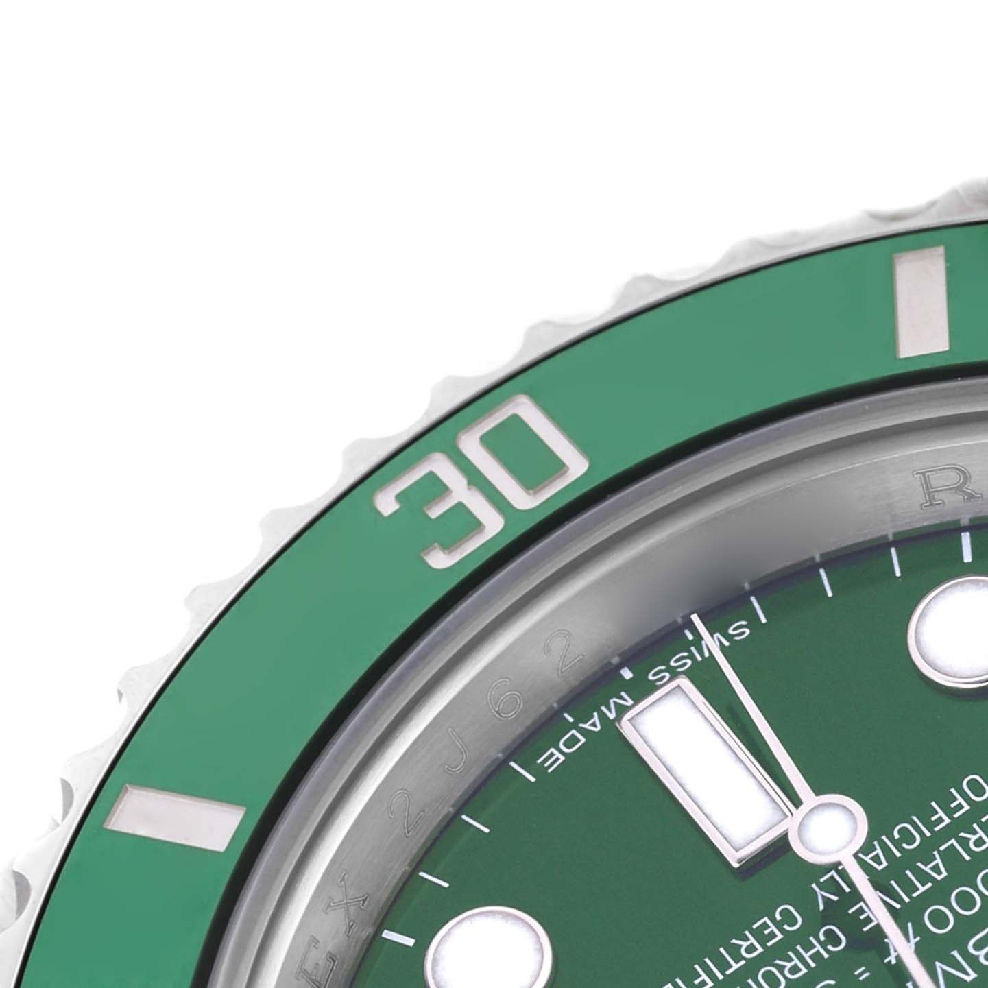 The image shows a close-up of the Rolex Submariner 116610LV Men's Stainless Steel Green Dial's green bezel and part of the dial, highlighting the "30" marker.