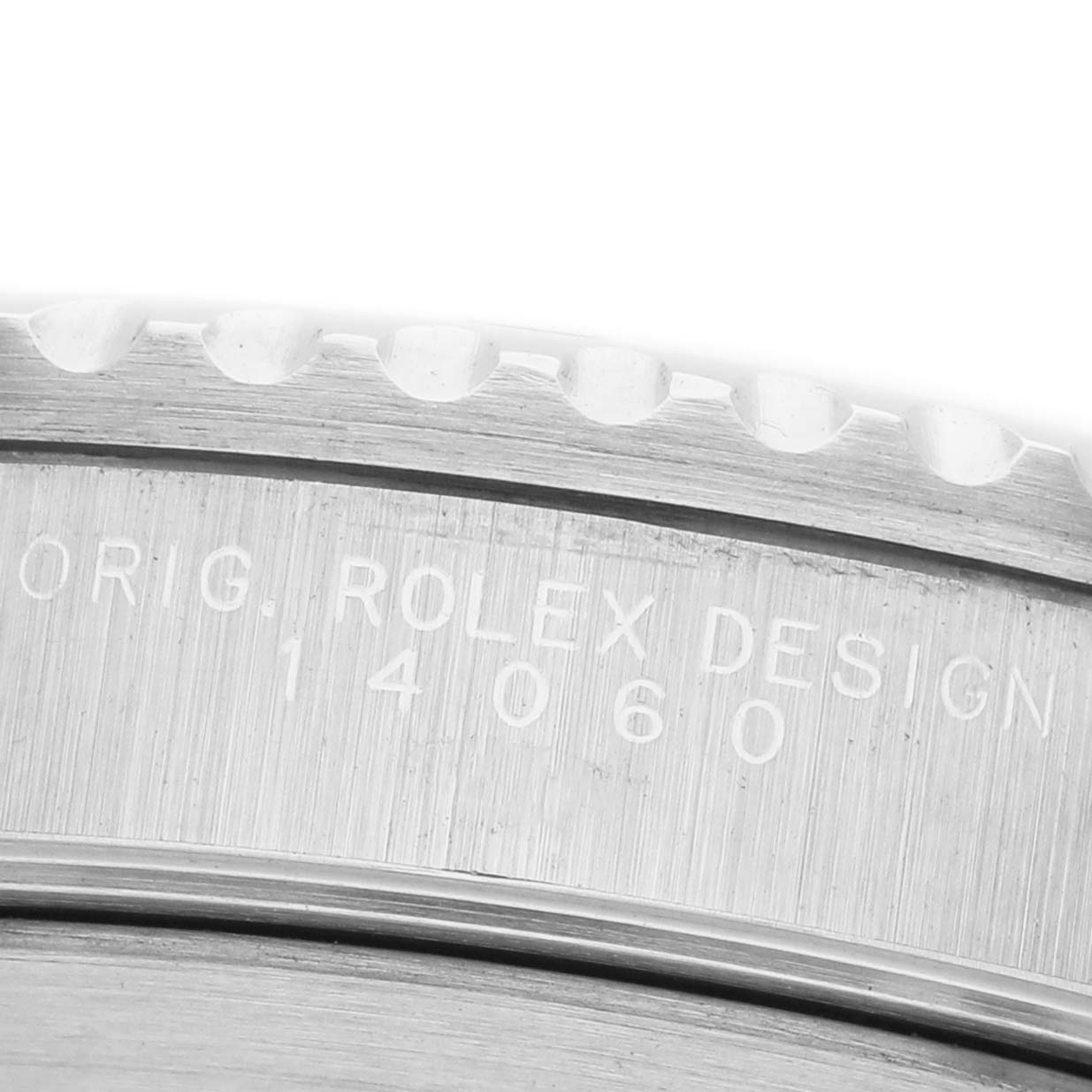 The image shows a close-up of the engraved side of a Rolex Submariner 14060 Men's Stainless Steel Black Dial, highlighting the model number and part of the bezel.