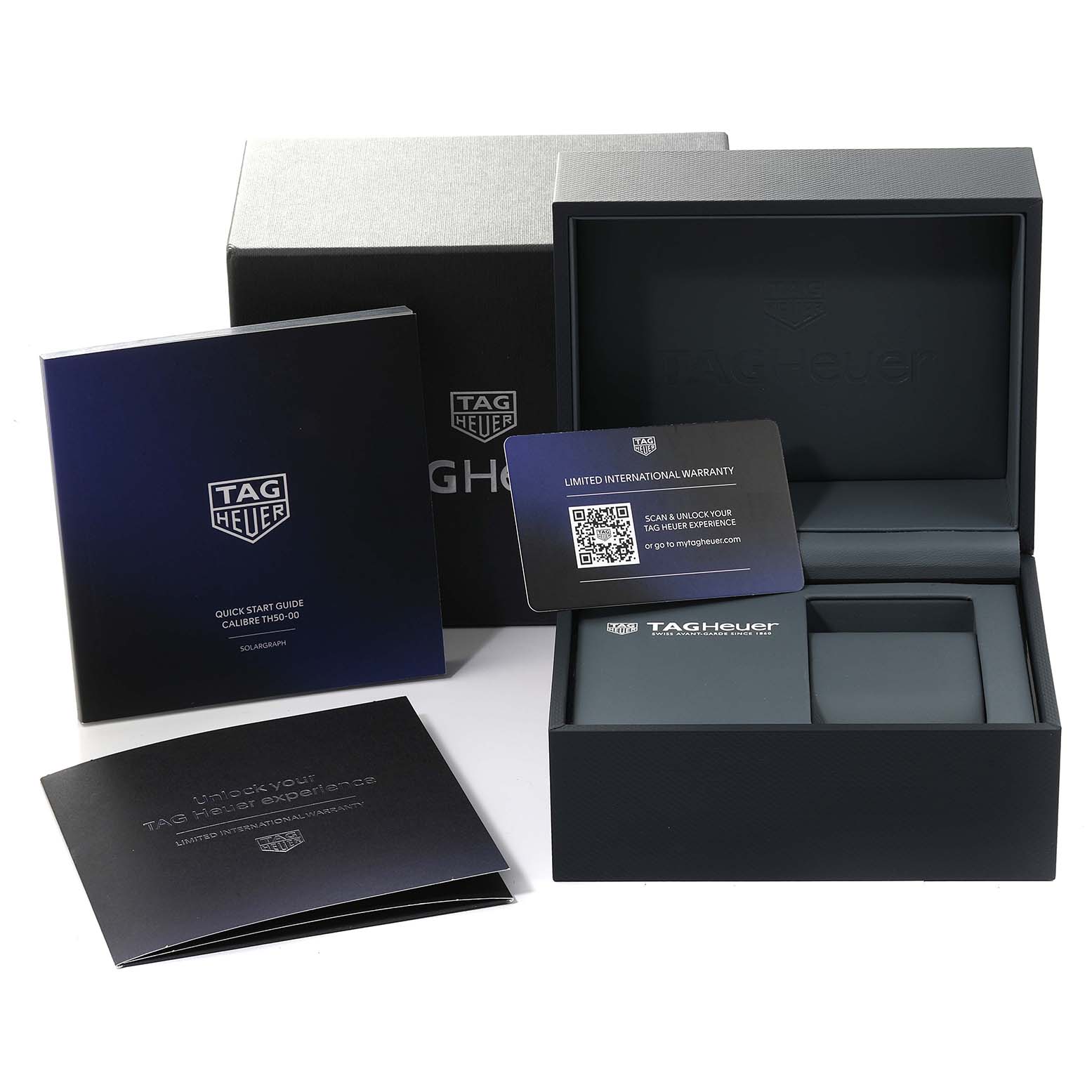 The image shows the packaging materials and accessories of a Tag Heuer Aquaracer WBP1113.BA0000 Men's Stainless Steel Blue Dial WBP1113.BA0000 Men's Stainless Steel Blue Dial, including the box, booklets, and warranty card.