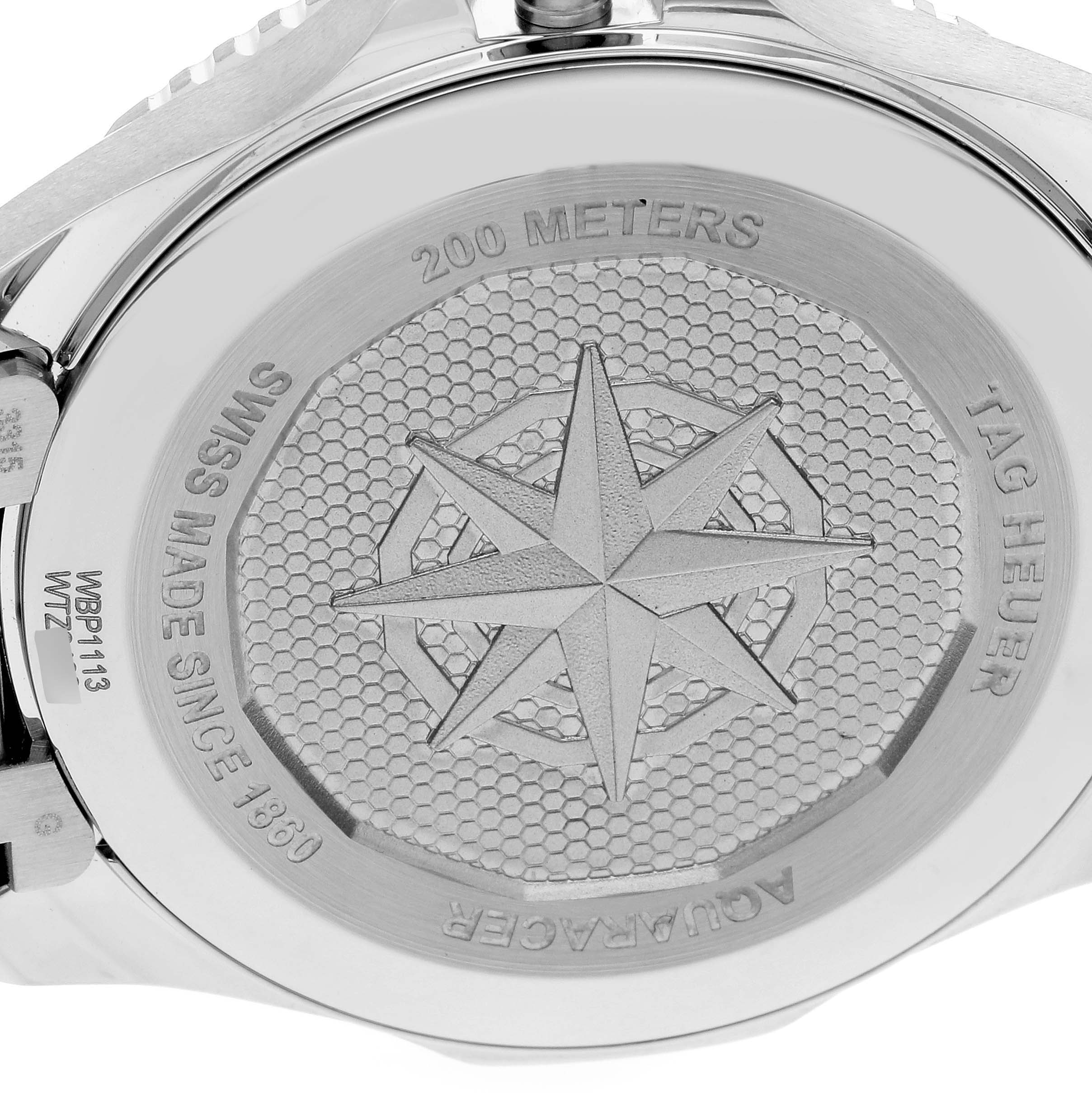 This image shows the back of a Tag Heuer Aquaracer WBP1113.BA0000 Men's Stainless Steel Blue Dial WBP1113.BA0000 Men's Stainless Steel Blue Dial watch, highlighting its water resistance and compass rose design.