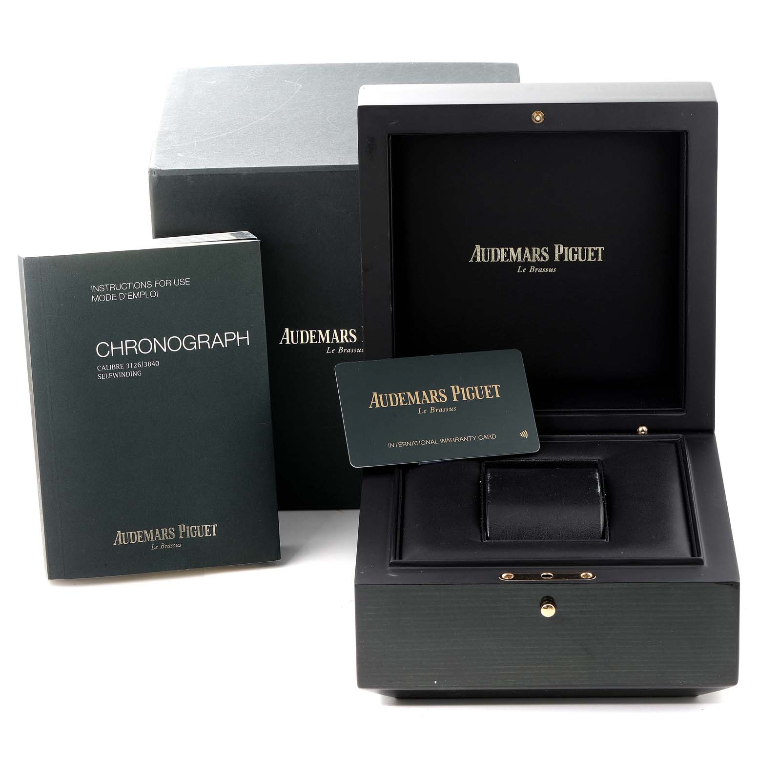 The image shows the packaging, instructions, and warranty card for a Royal Oak model by Audemars Piguet.