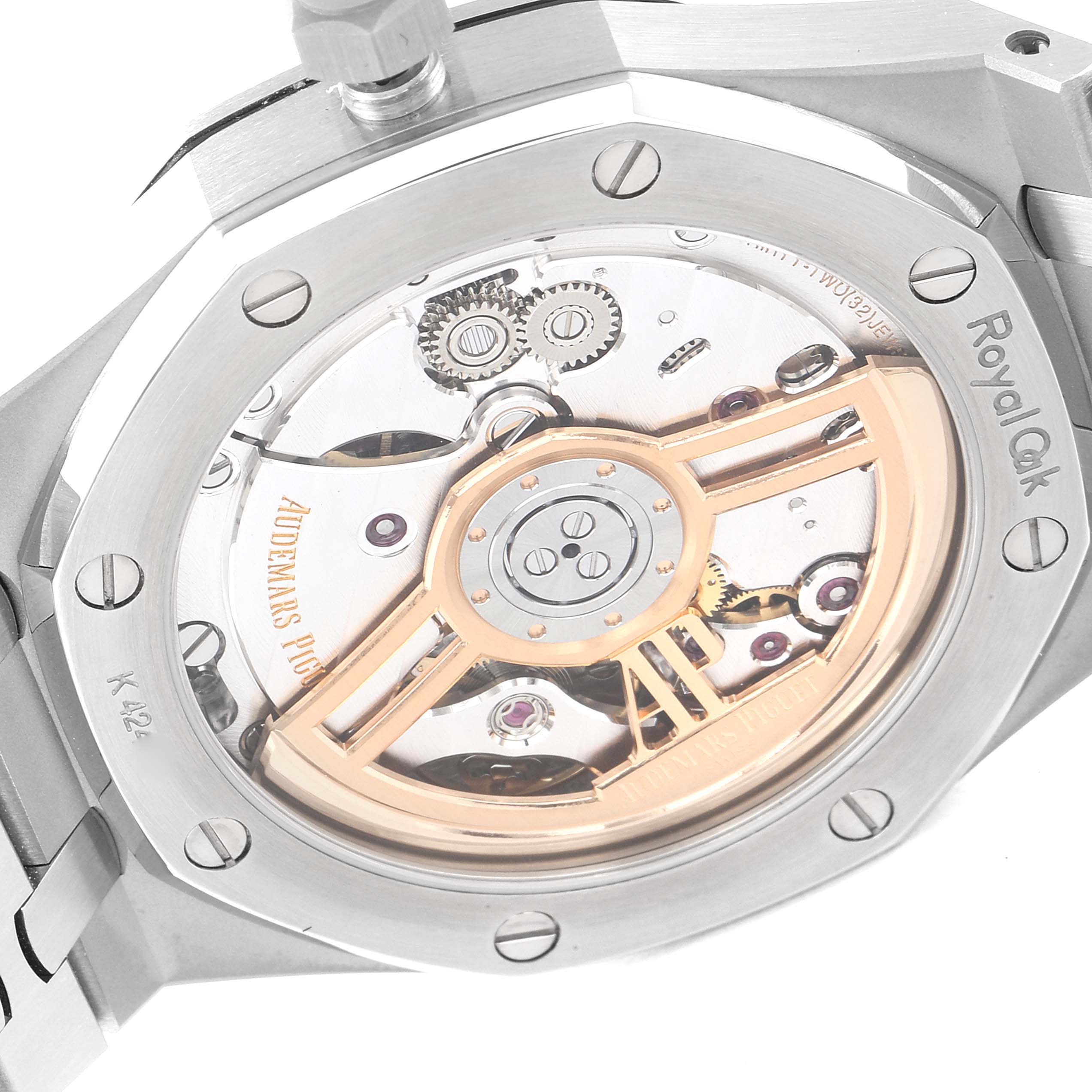 The image shows the back view of the Royal Oak by Audemars Piguet, highlighting its movement and rotor.