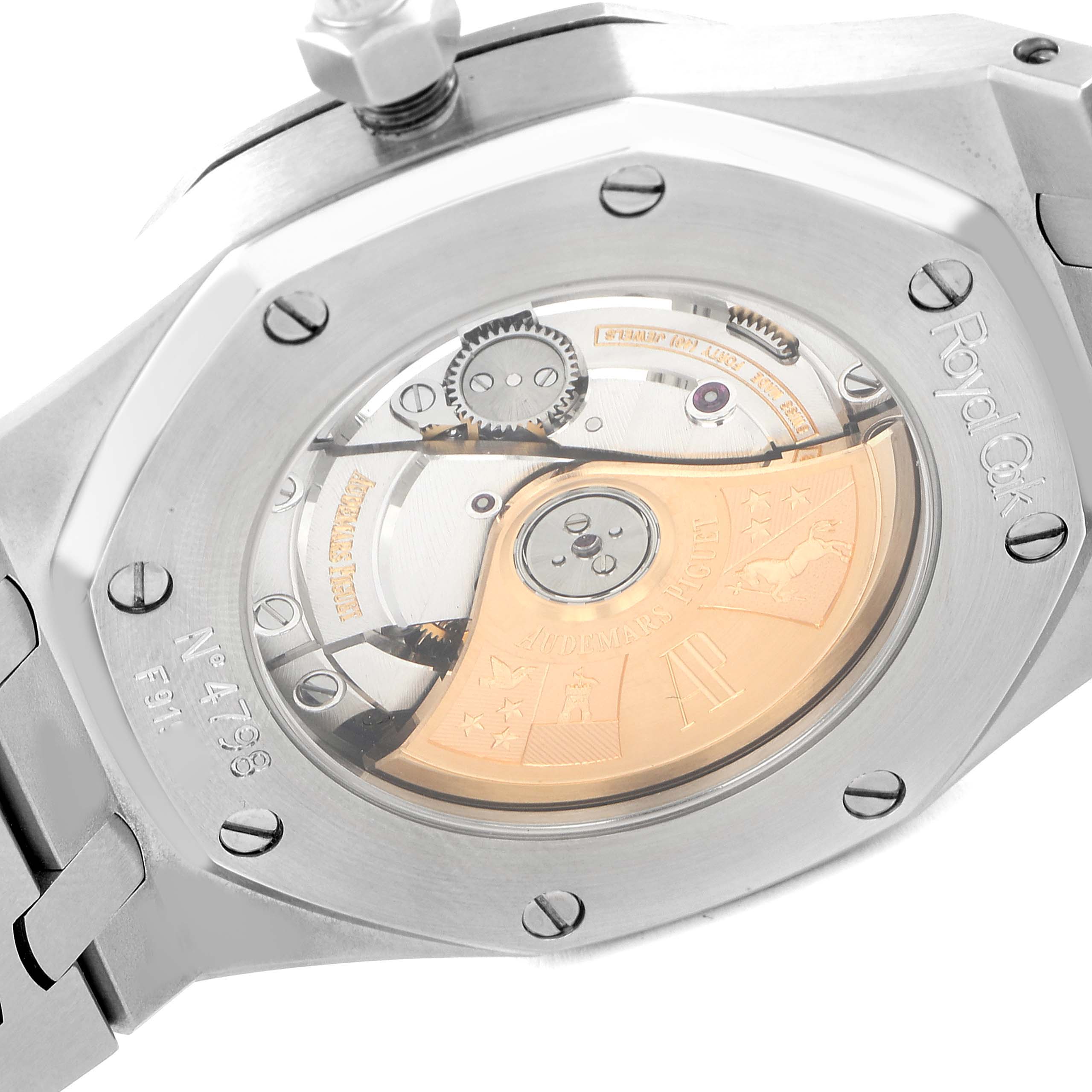 The image shows the back of a Royal Oak by Audemars Piguet, revealing its movement and the transparent case back.