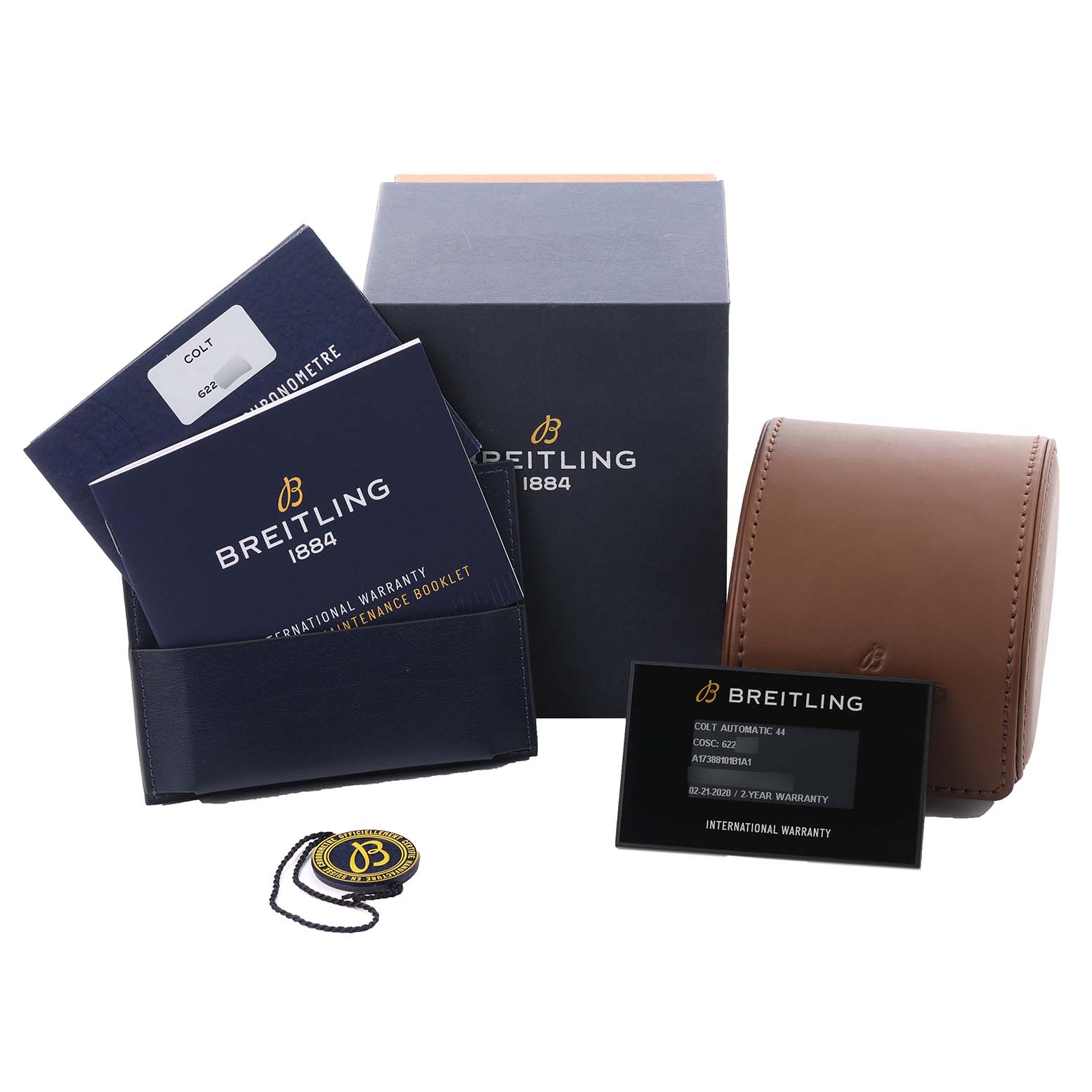 The image shows watch accessories for the Breitling Colt A17388101B1A1 Men's Stainless Steel Black Dial A17388101B1A1 Men's Stainless Steel Black Dial model, including a box, booklet, warranty card, and a travel case.