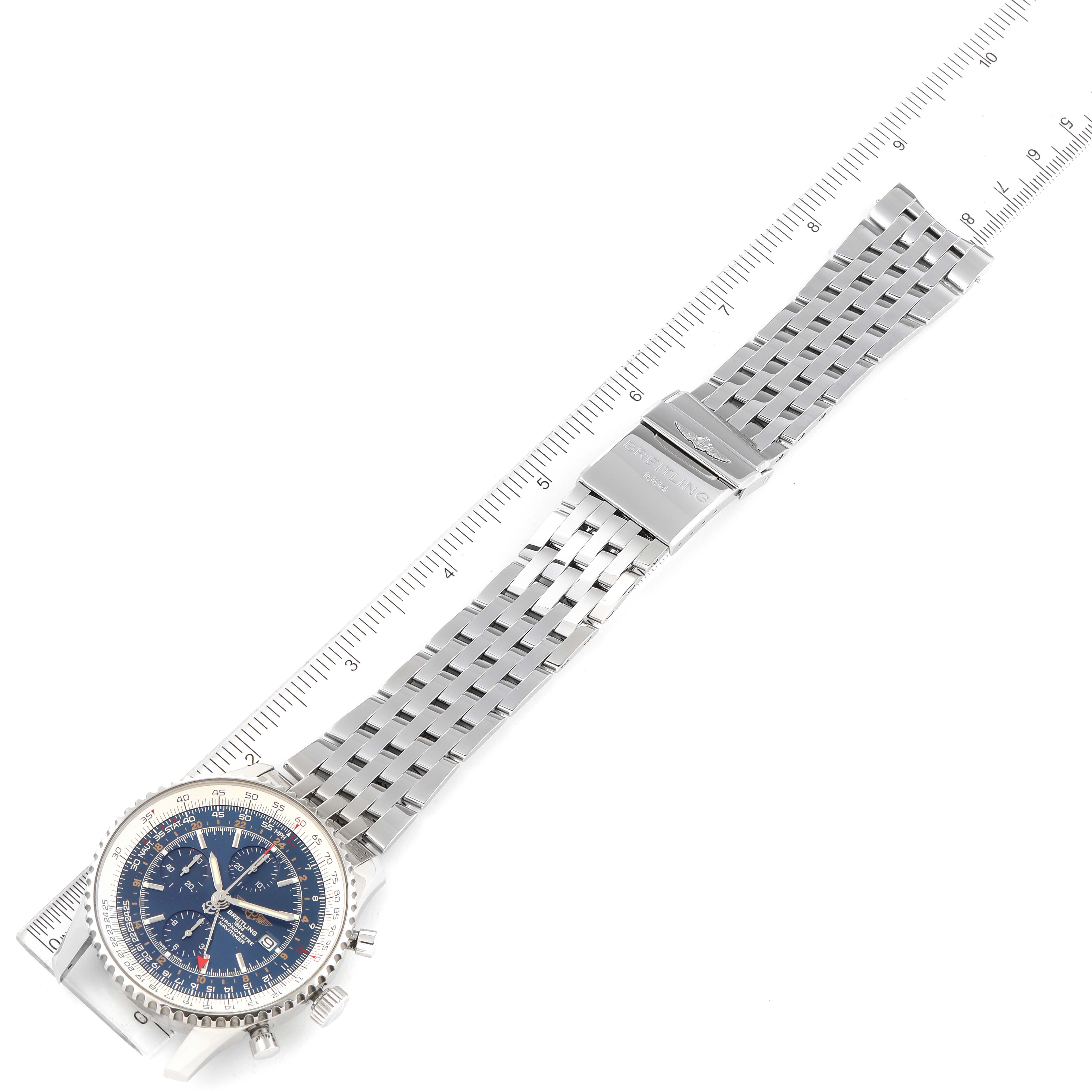 The image shows a Breitling Navitimer A24322 Men
s Stainless Steel Blue Dial A24322 Men
s Stainless Steel Blue Dial watch laid flat, displaying the face, bezel, and steel bracelet with clasp, alongside a ruler for scale.