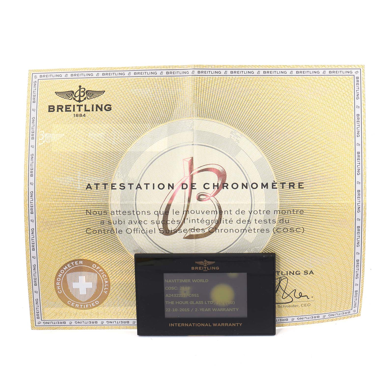 The image shows a Breitling Navitimer A24322 Men
s Stainless Steel Blue Dial A24322 Men
s Stainless Steel Blue Dial chronometer certificate and an international warranty card.