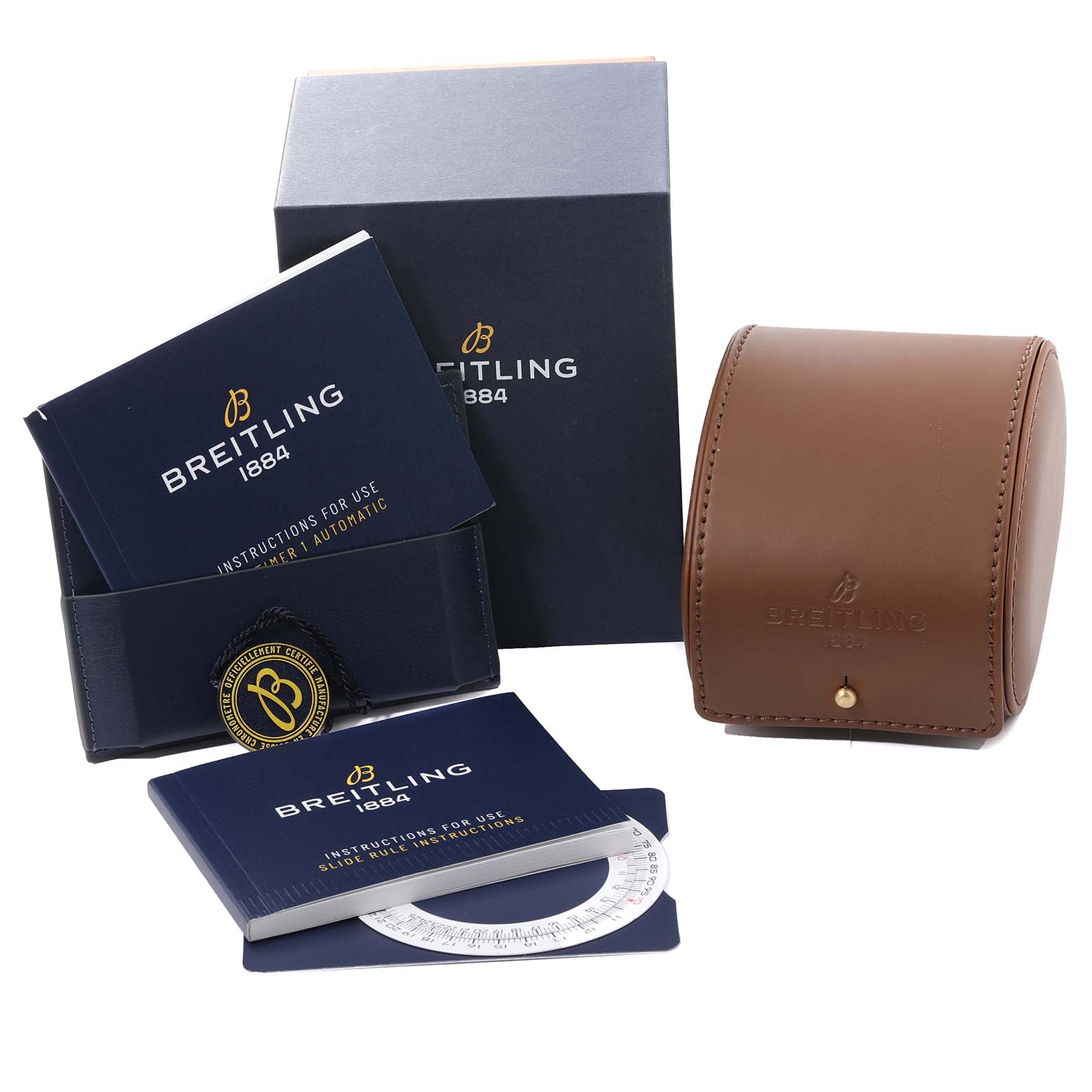 The image shows the packaging, instruction booklets, and a brown leather case for a Breitling Superocean A13313 Men's Stainless Steel Green Dial A13313 Men's Stainless Steel Green Dial watch.