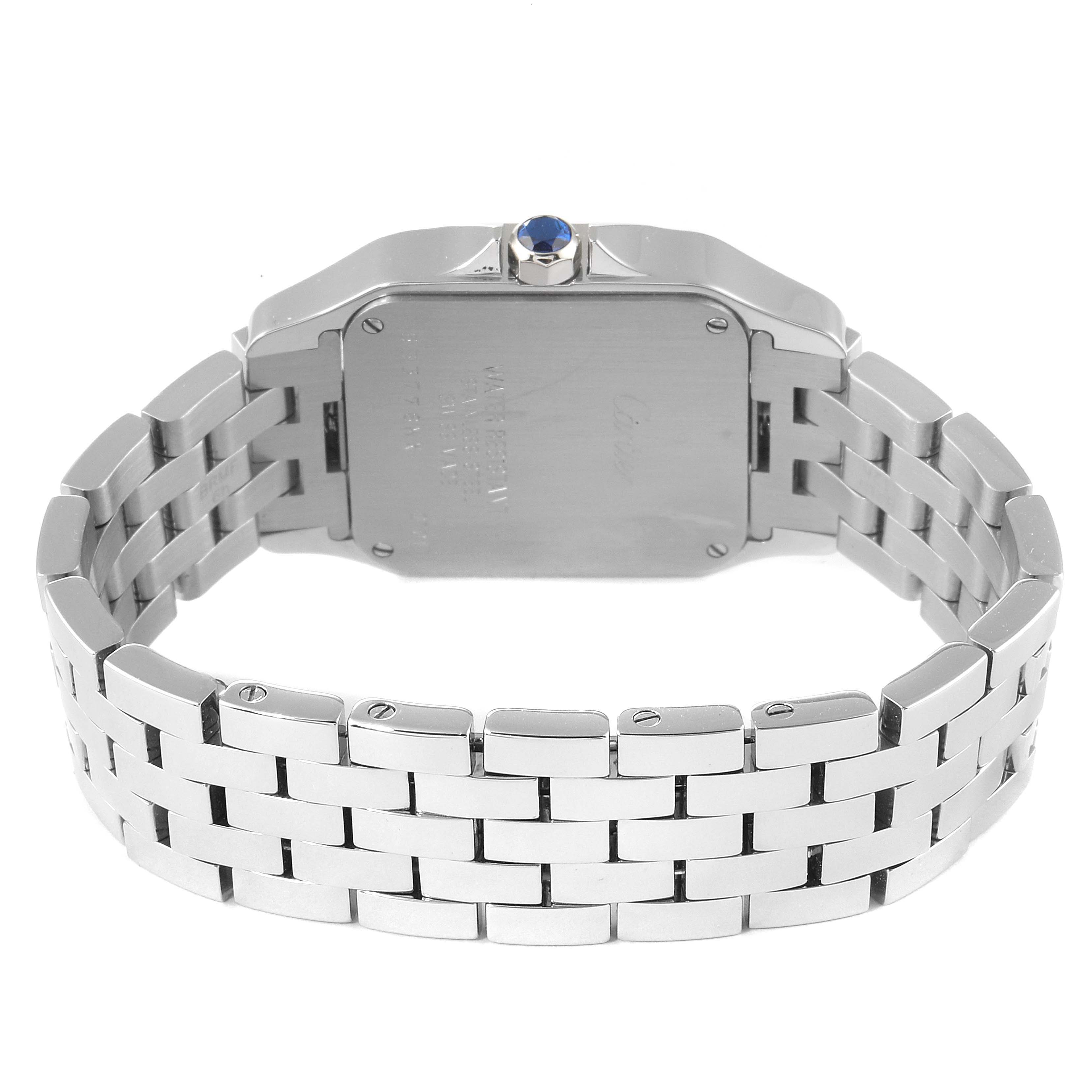 The image shows the back angle of a Santos Demoiselle model by Cartier, highlighting the case back and metal bracelet.