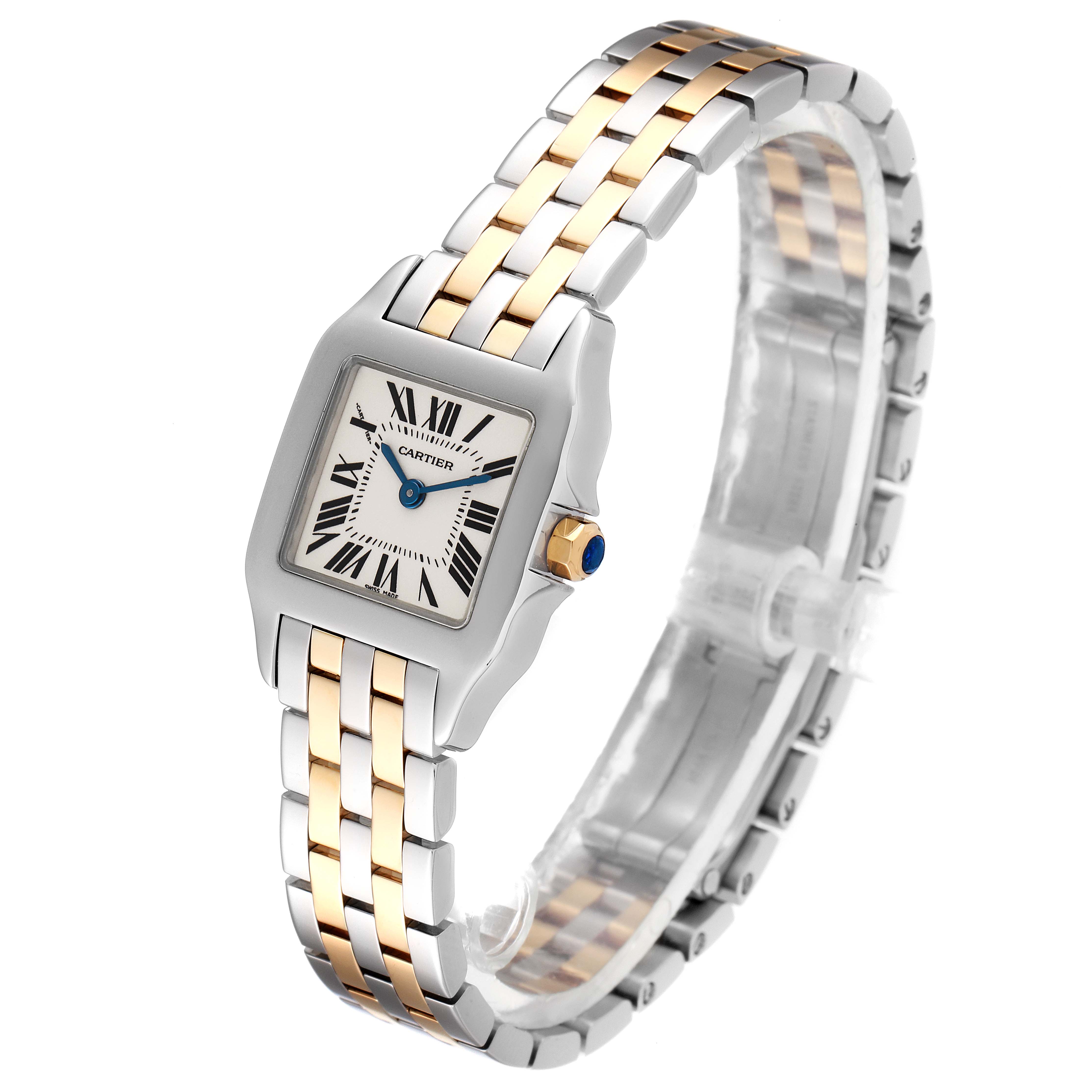 This image shows a Cartier Santos Demoiselle W25066Z6 Women
s Stainless Steel Silver Dial W25066Z6 Women
s Stainless Steel Silver Dial watch at an angle highlighting the face, bezel, and two-tone band.