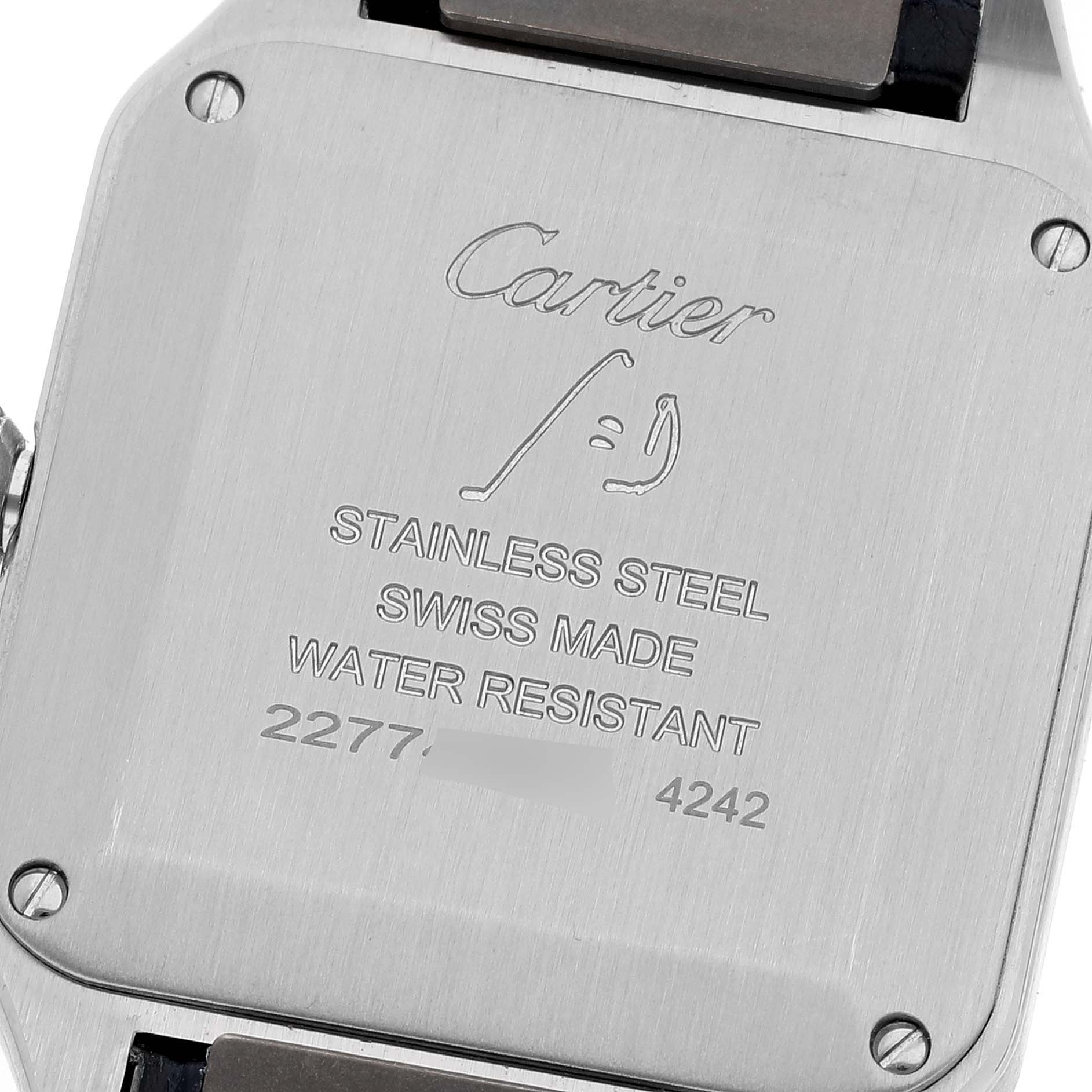 The image shows the back case of a Cartier Santos WSSA0023 Women's Stainless Steel Silver Dial WSSA0023 Women's Stainless Steel Silver Dial watch, featuring engravings indicating its stainless steel material and water resistance.