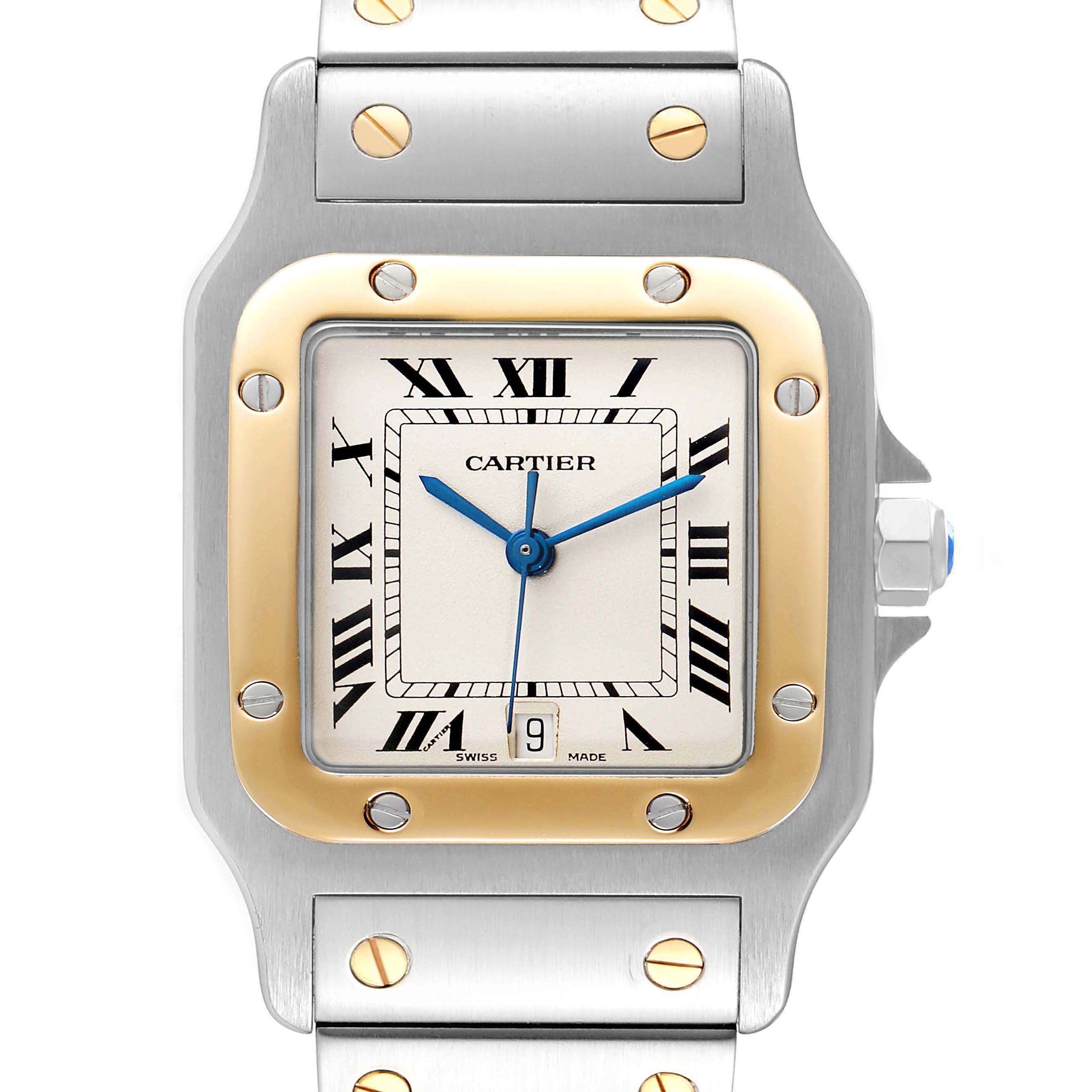 This image shows a close-up, front view of the Cartier Santos 187901 Men
s Steel and Gold (two tone) Silver Dial 187901 Men
s Steel and Gold (two tone) Silver Dial watch, highlighting the face, bezel, and part of the bracelet.