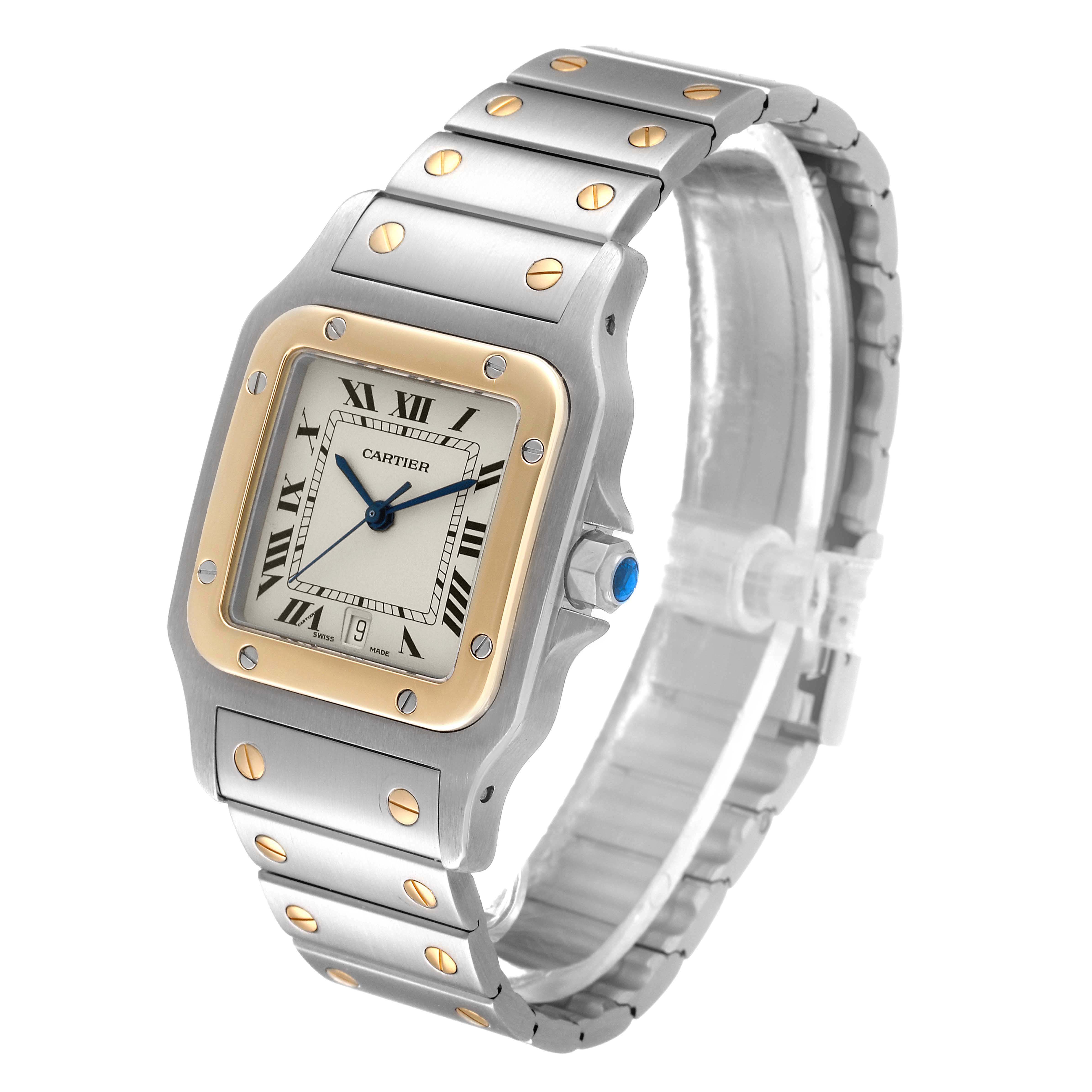 The image shows a Cartier Santos 187901 Men
s Steel and Gold (two tone) Silver Dial 187901 Men
s Steel and Gold (two tone) Silver Dial model watch at a slight angle, highlighting its face, bezel, and metal bracelet with gold accents.
