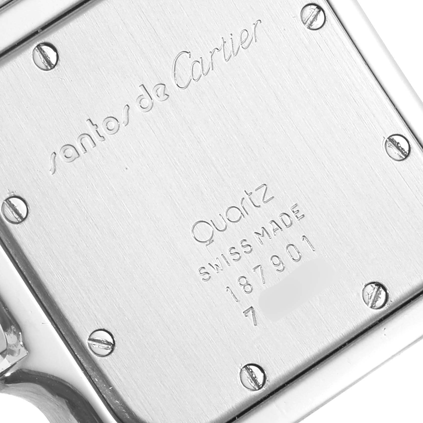 The image shows the back case of a Cartier Santos 187901 Men
s Steel and Gold (two tone) Silver Dial 187901 Men
s Steel and Gold (two tone) Silver Dial watch, displaying the engraved text and screw details.