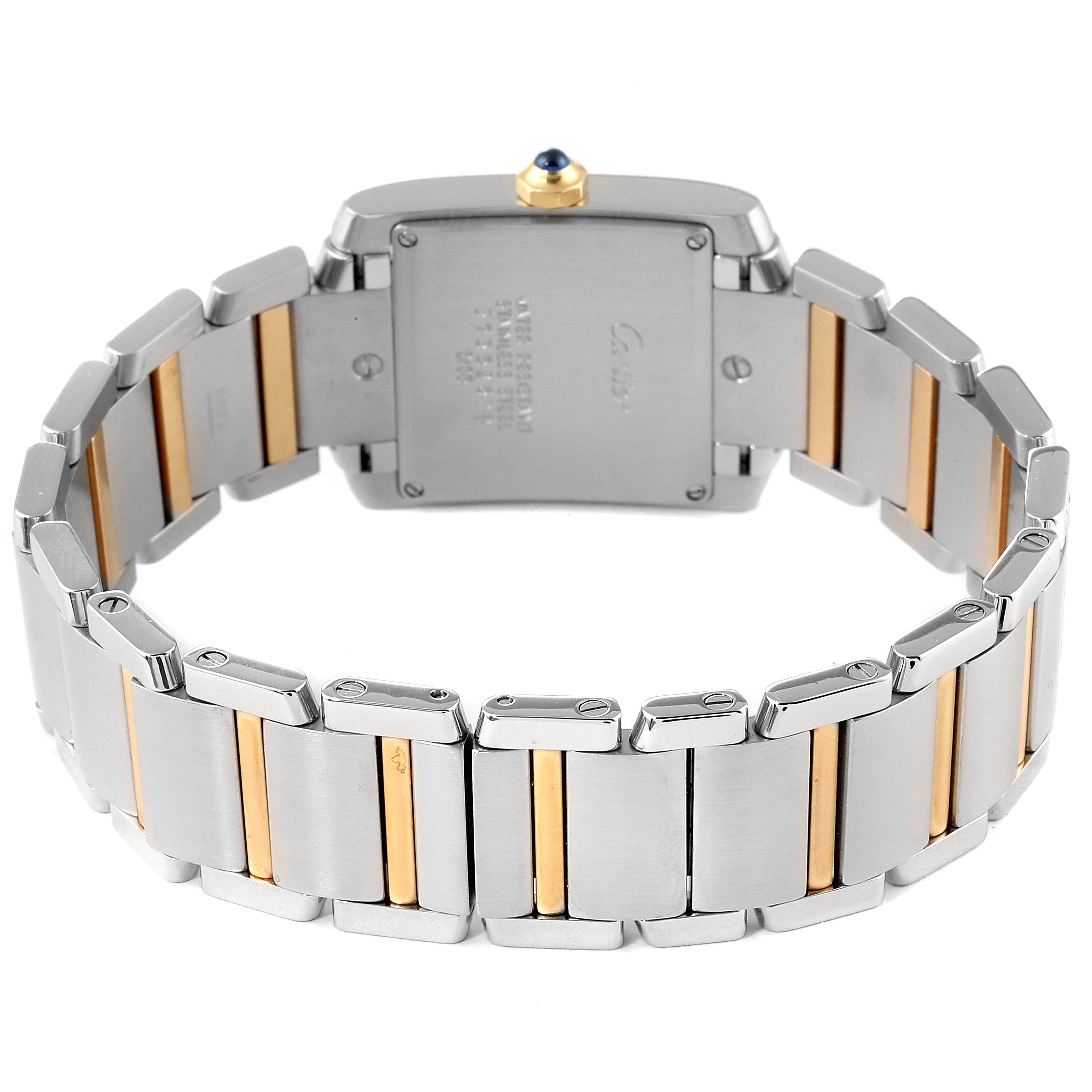This image shows the back view of the Tank Française model by Cartier, highlighting its metal bracelet with gold accents.