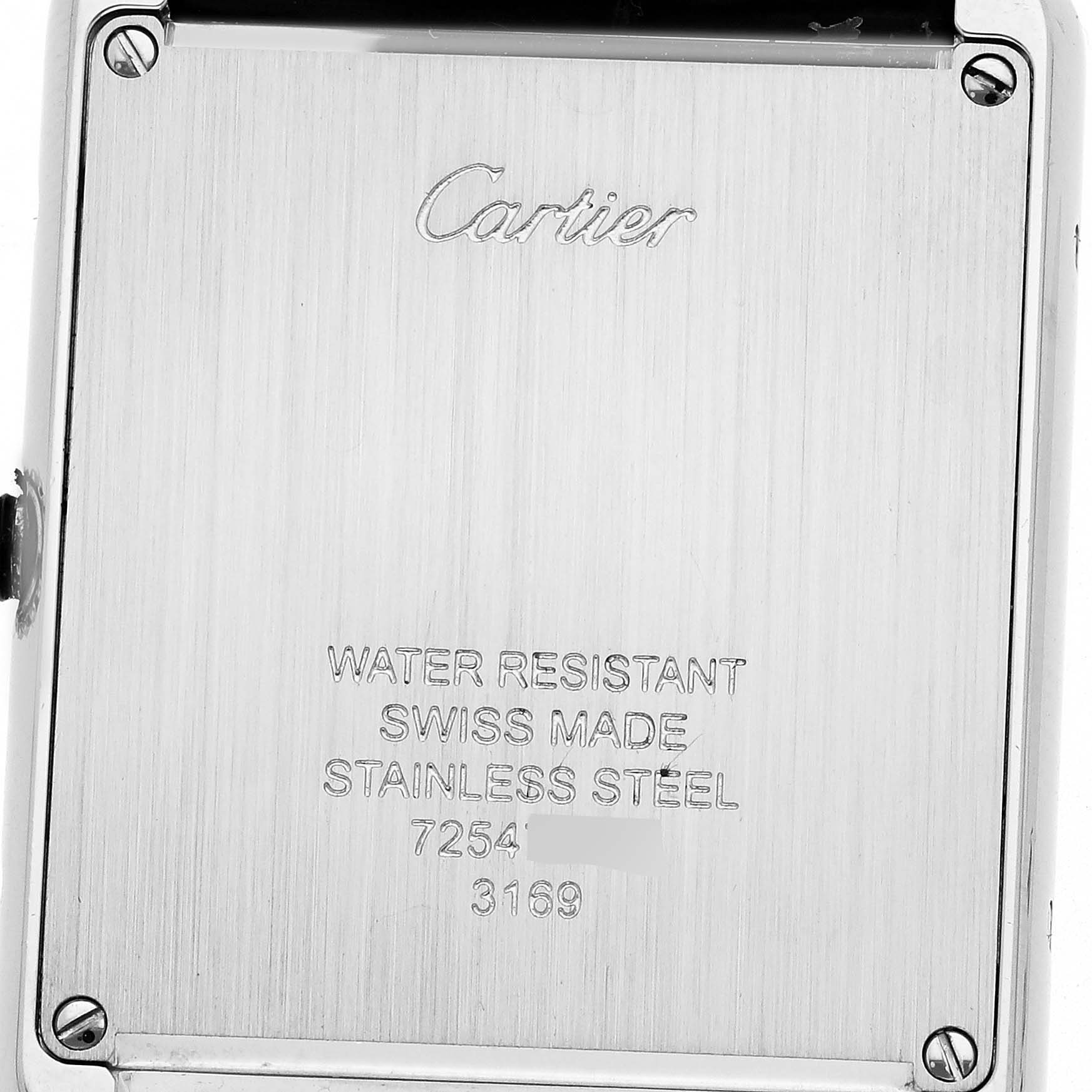 The image shows the back case of the Cartier Tank Solo WSTA0028 Men
s Stainless Steel Silver Dial WSTA0028 Men
s Stainless Steel Silver Dial watch, highlighting engravings and screws.
