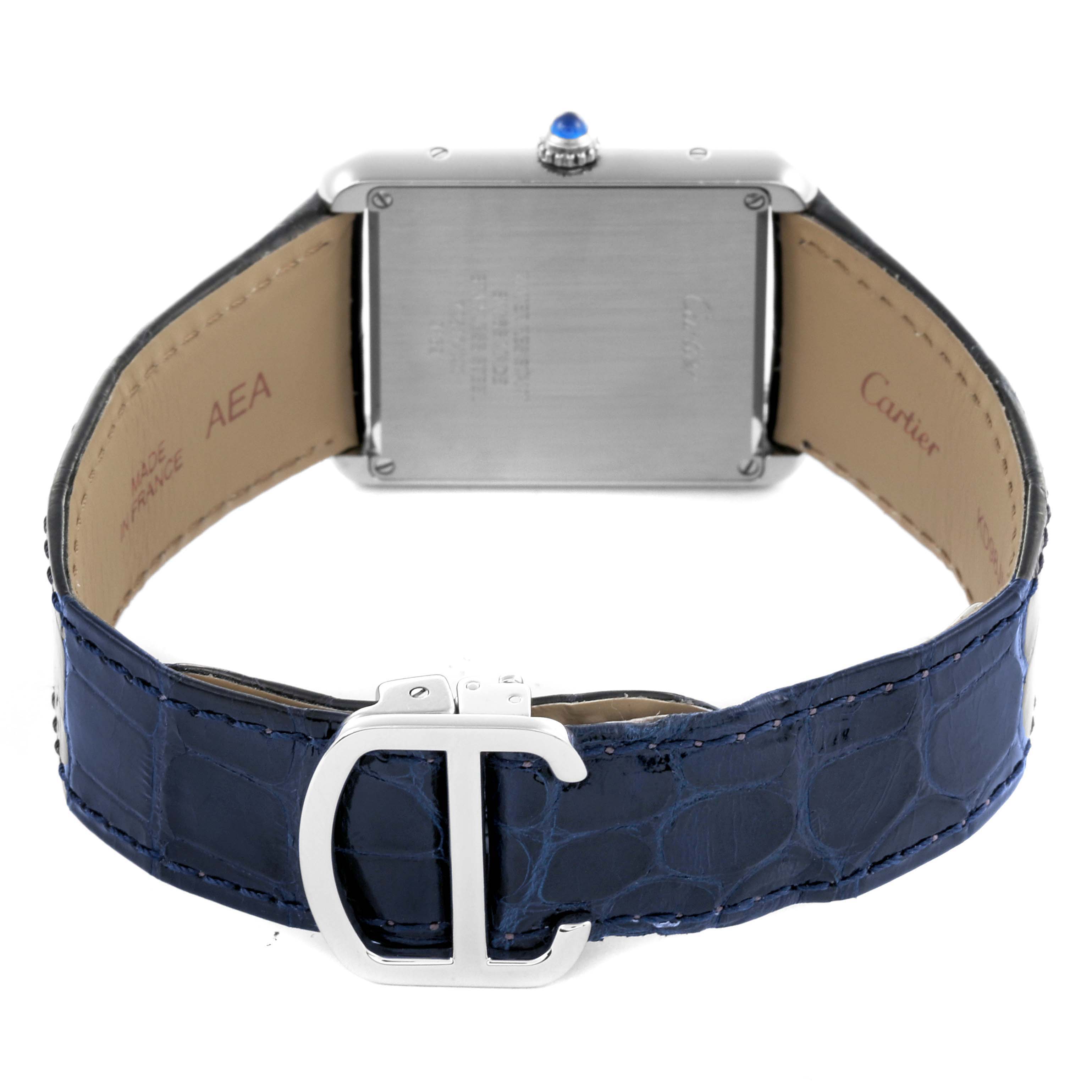 The Cartier Tank Solo WSTA0028 Men
s Stainless Steel Silver Dial WSTA0028 Men
s Stainless Steel Silver Dial watch is shown from the back, highlighting the case back, blue leather strap, and clasp.