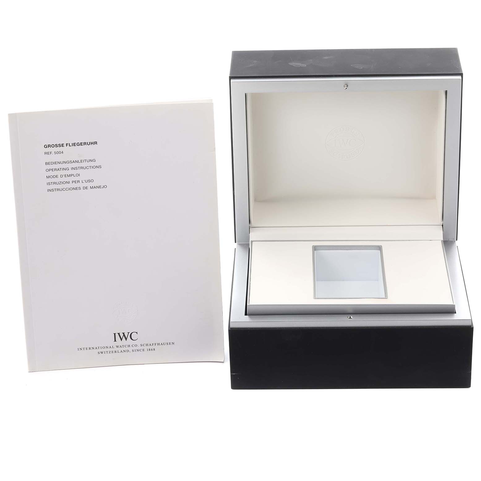 The image shows an open IWC Pilot IW500402 Men's White Gold Grey Dial IW500402 Men's White Gold Grey Dial watch box and instructions, viewed from the front.