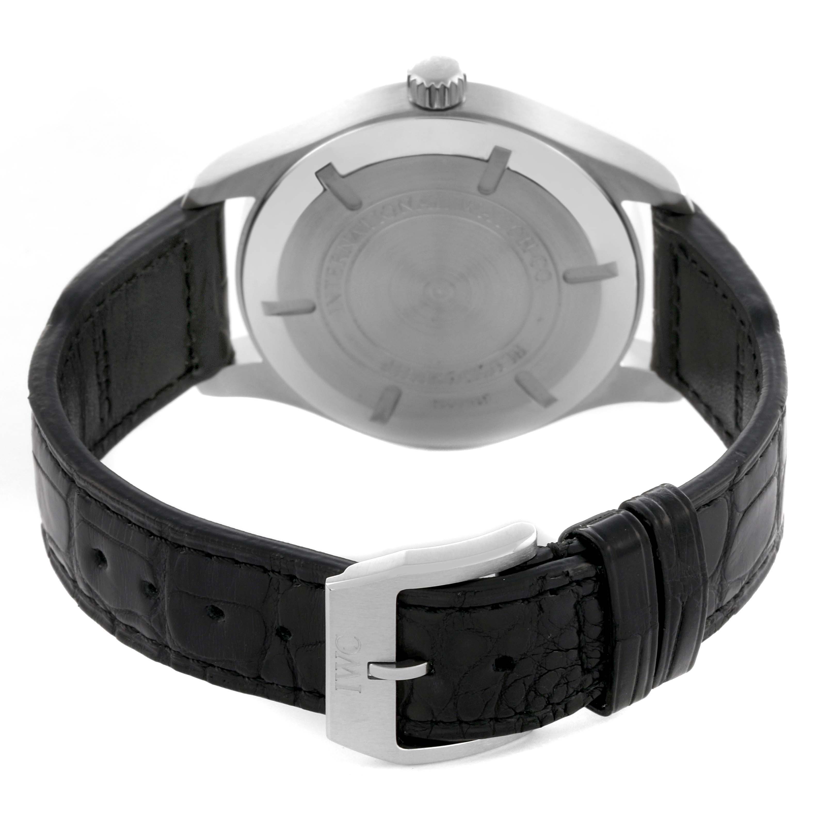The image shows the backside of an IWC Pilot IW326501 Men's Stainless Steel Black Dial IW326501 Men's Stainless Steel Black Dial watch, focusing on the case back and black leather strap with a buckle.