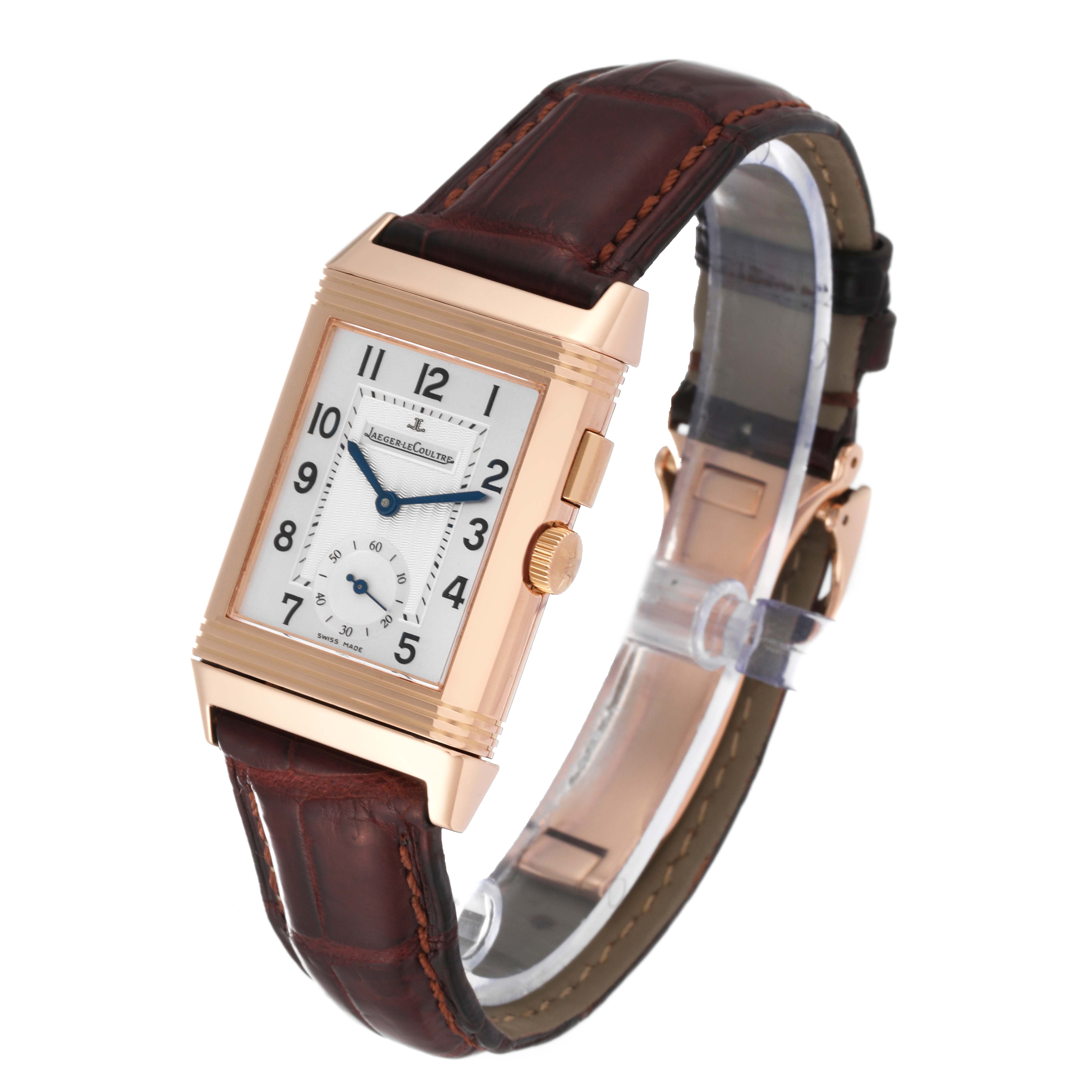 This is a Jaeger-LeCoultre Reverso watch shown at a slight angle, displaying the face, crown, and brown leather strap.