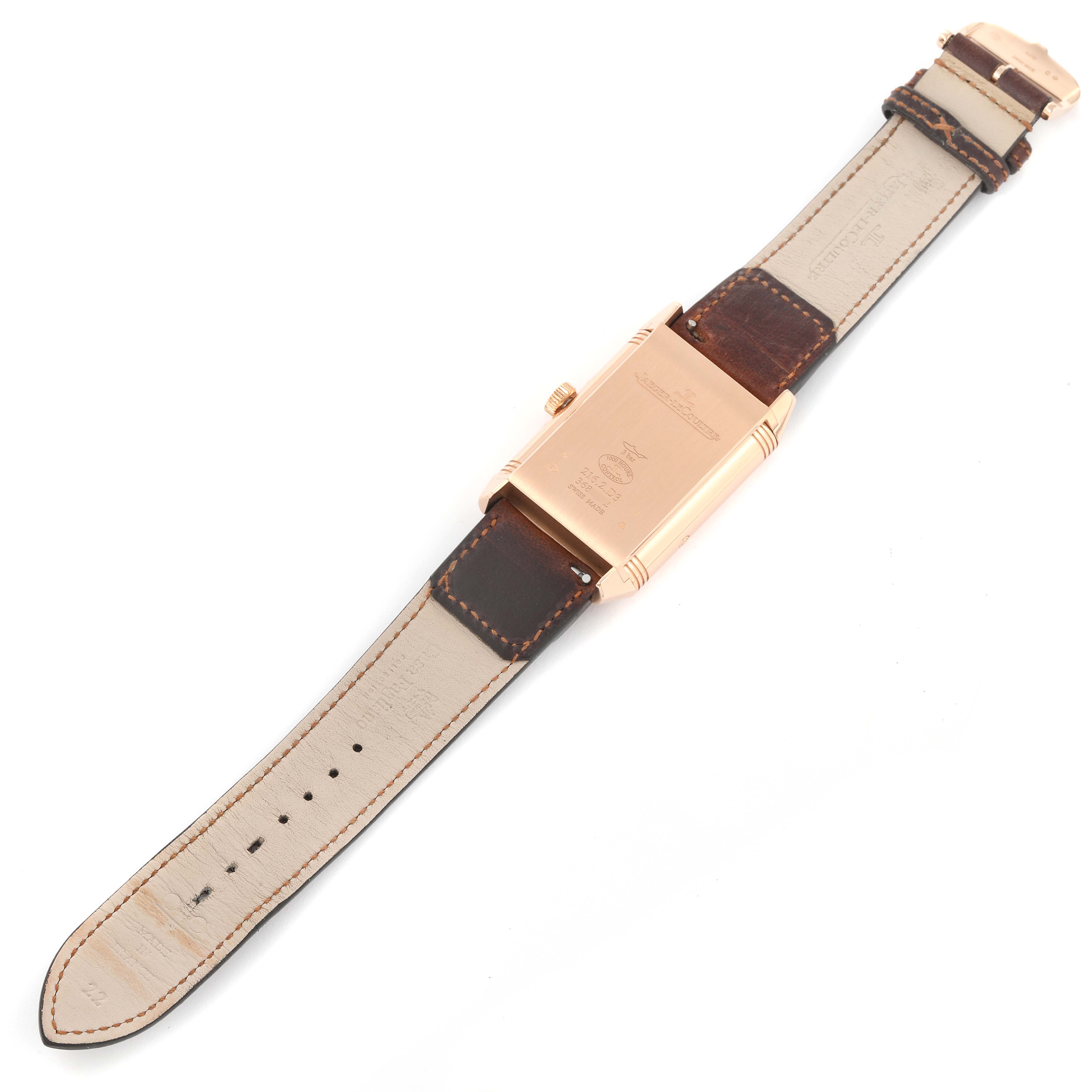 This image shows the back view of a Jaeger LeCoultre Reverso Q3912530 Men's Rose Gold Silver Dial Q3912530 Men's Rose Gold Silver Dial watch with its leather strap extended.