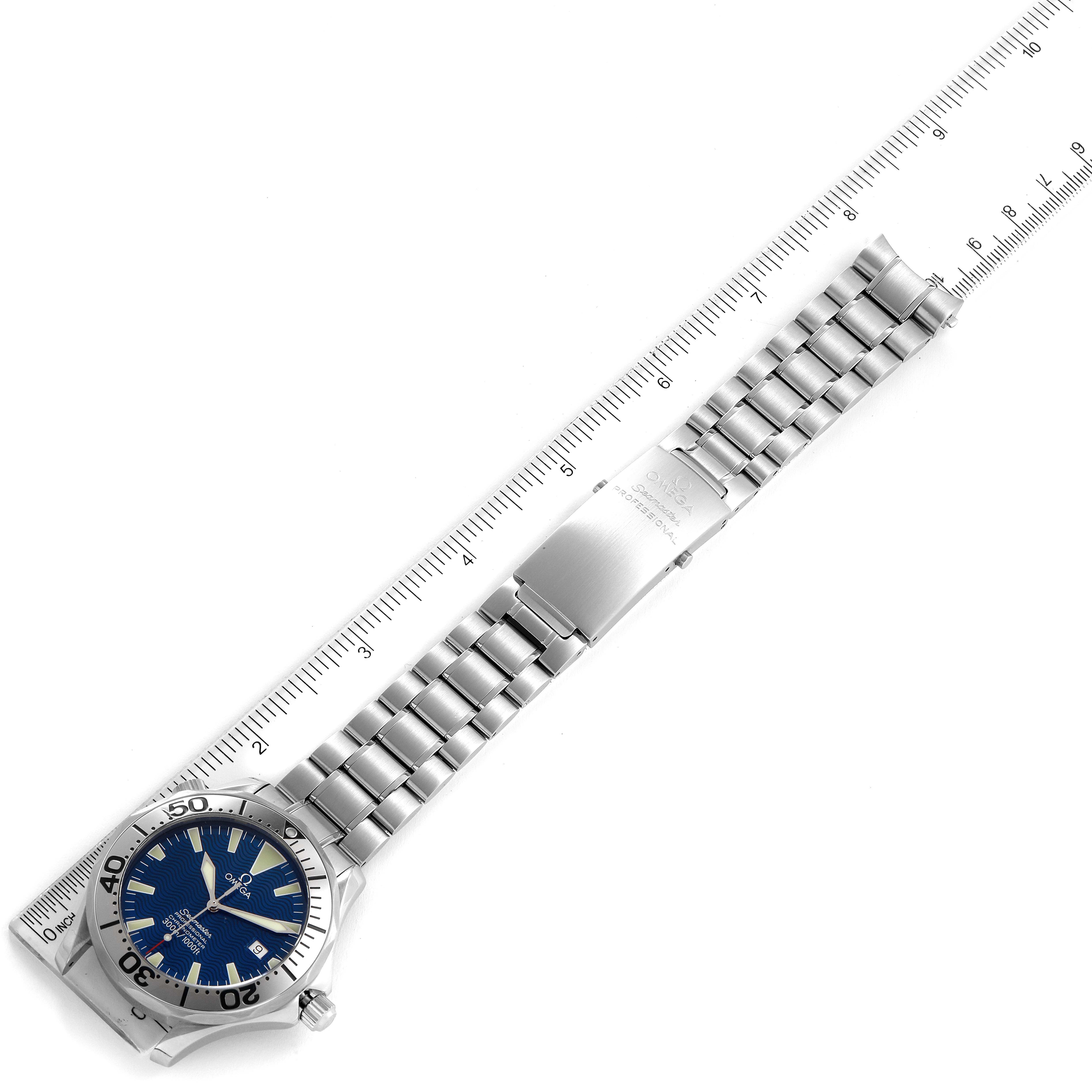 The image shows the Omega Seamaster 2255.80.00 Men's Stainless Steel Blue Dial 2255.80.00 Men's Stainless Steel Blue Dial watch laid flat, displaying the face, bezel, and stainless steel bracelet alongside a ruler.