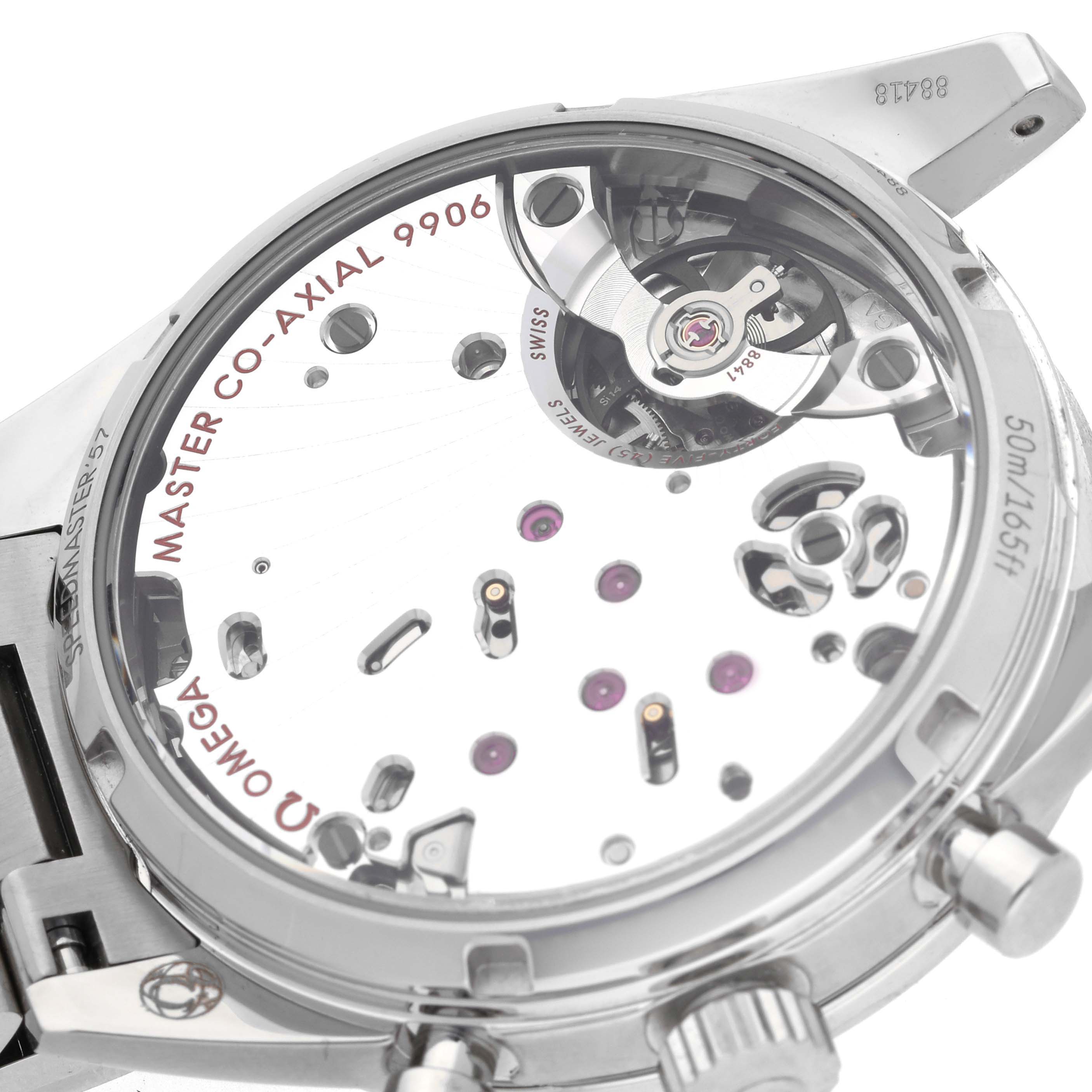 The image shows the back of the Omega Speedmaster 332.10.41.51.01.001 Men's Stainless Steel Green Dial 332.10.41.51.01.001 Men's Stainless Steel Green Dial, highlighting its Master Co-Axial 9906 movement.