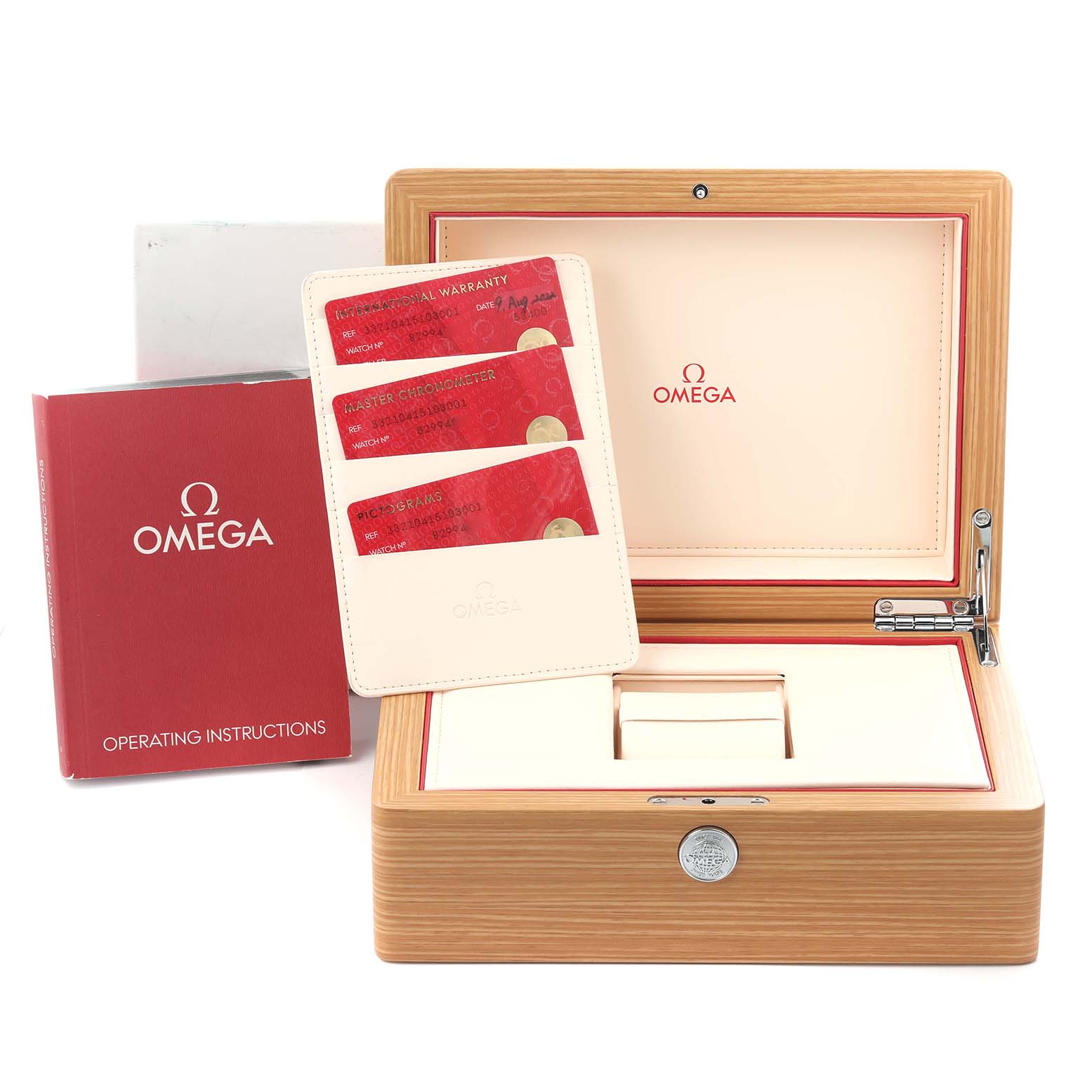 The image shows the Omega Speedmaster 332.10.41.51.03.001 Men's Stainless Steel Blue Dial 332.10.41.51.03.001 Men's Stainless Steel Blue Dial's wooden box, instruction booklet, and warranty cards.