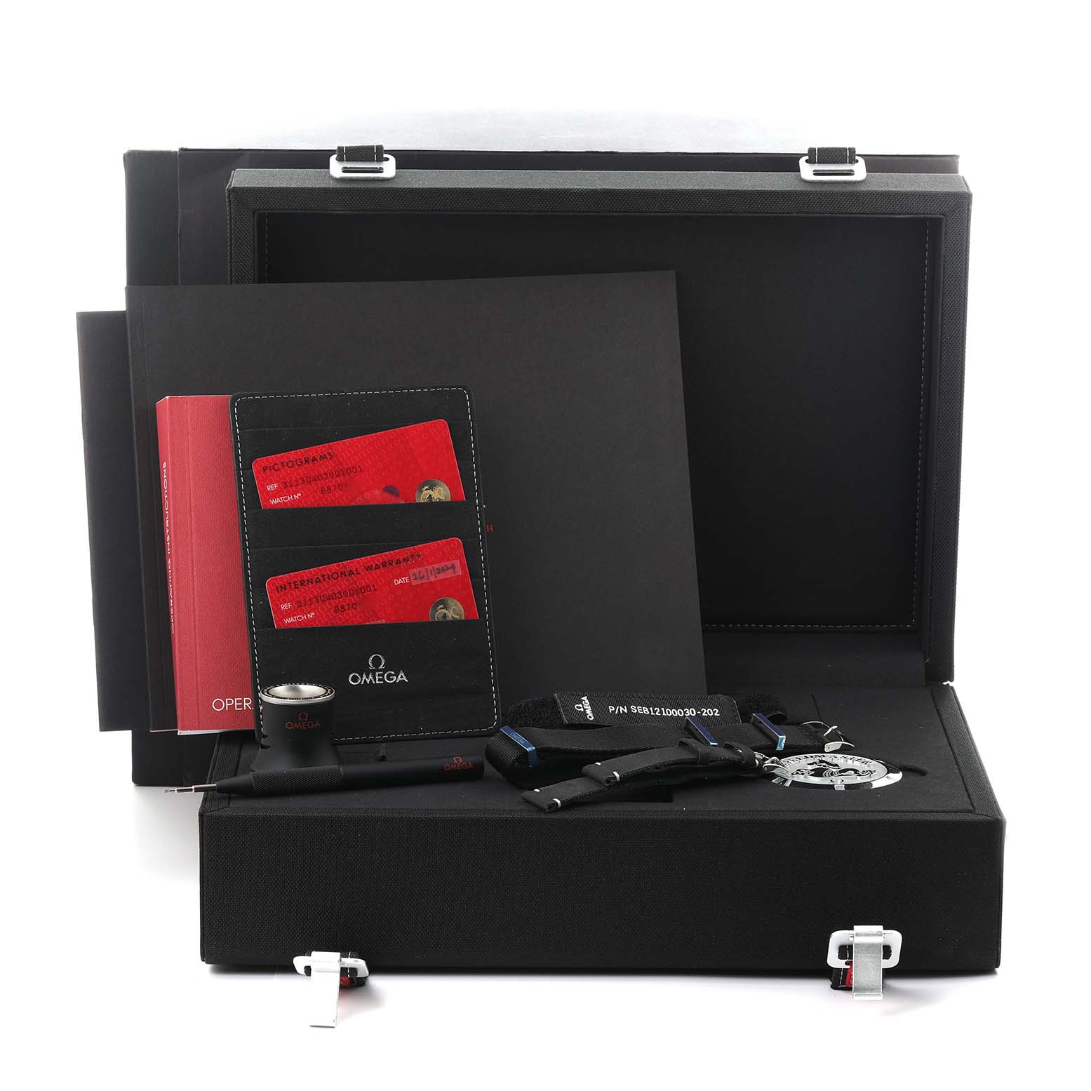 The image shows a flat-lay of Omega Speedmaster 311.30.40.30.01.001 Men
s Stainless Steel Black Dial 311.30.40.30.01.001 Men
s Stainless Steel Black Dial accessories, including cards, a strap, a manual, and a loupe in a presentation box.