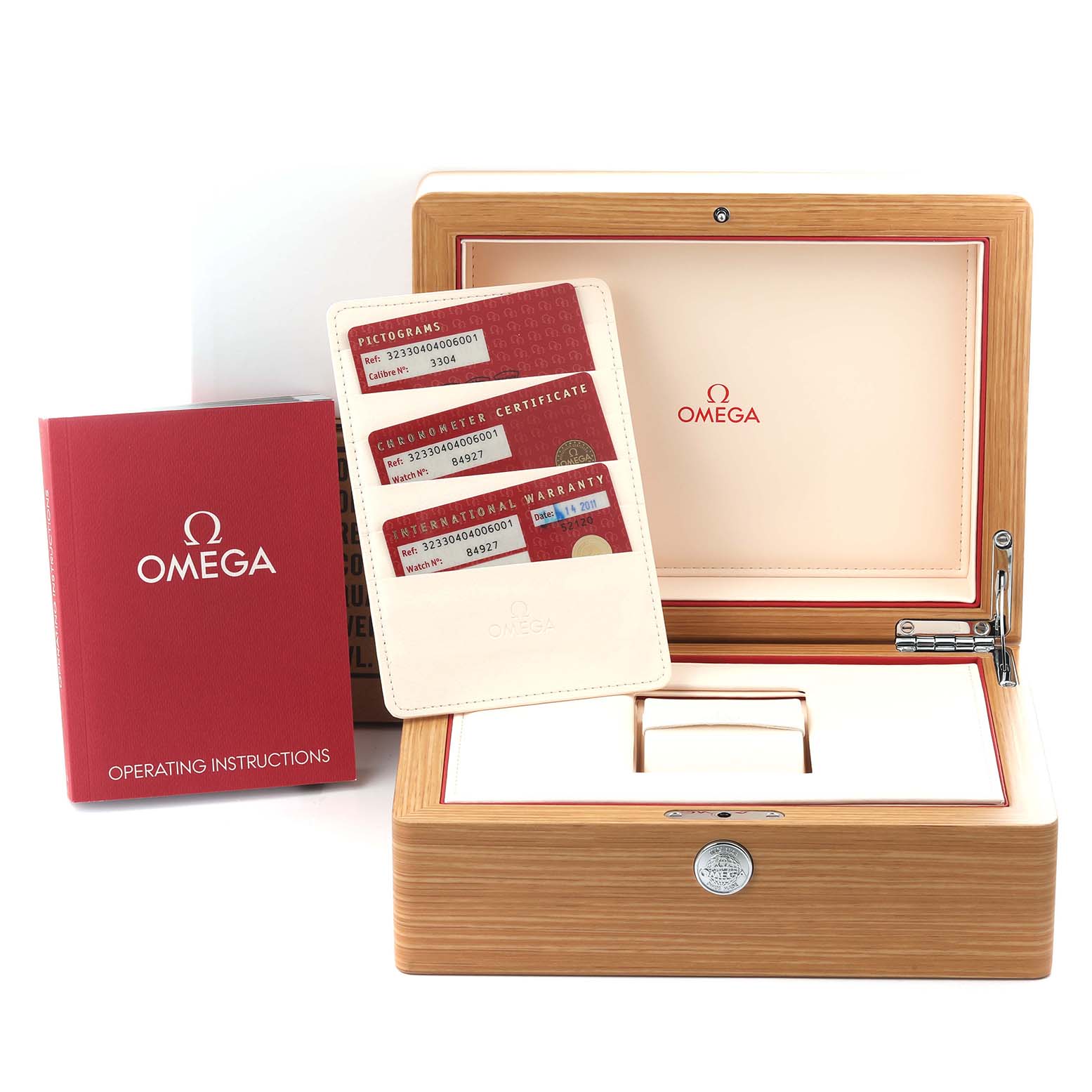 The image shows the Omega Speedmaster 323.30.40.40.06.001 Men's Stainless Steel Grey Dial 323.30.40.40.06.001 Men's Stainless Steel Grey Dial's box, instruction manual, and warranty cards from a front angle.