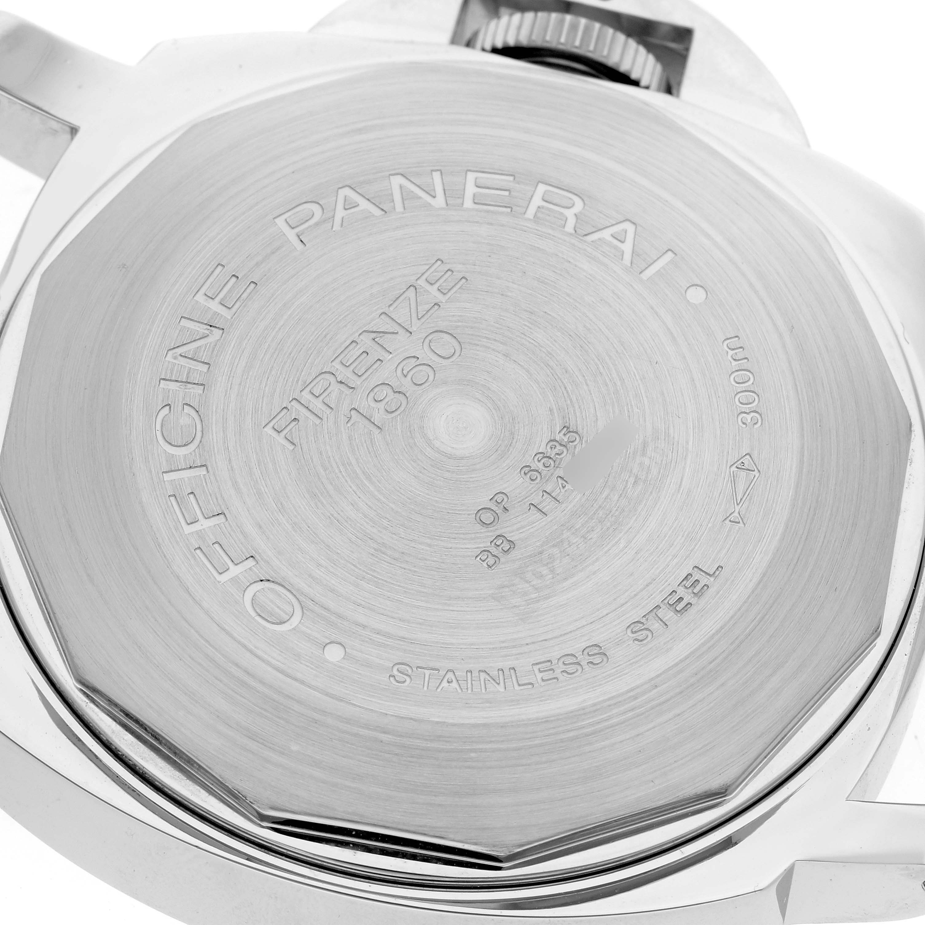 This image shows the back case of a Luminor model by Panerai, displaying engraved text and the crown protector.