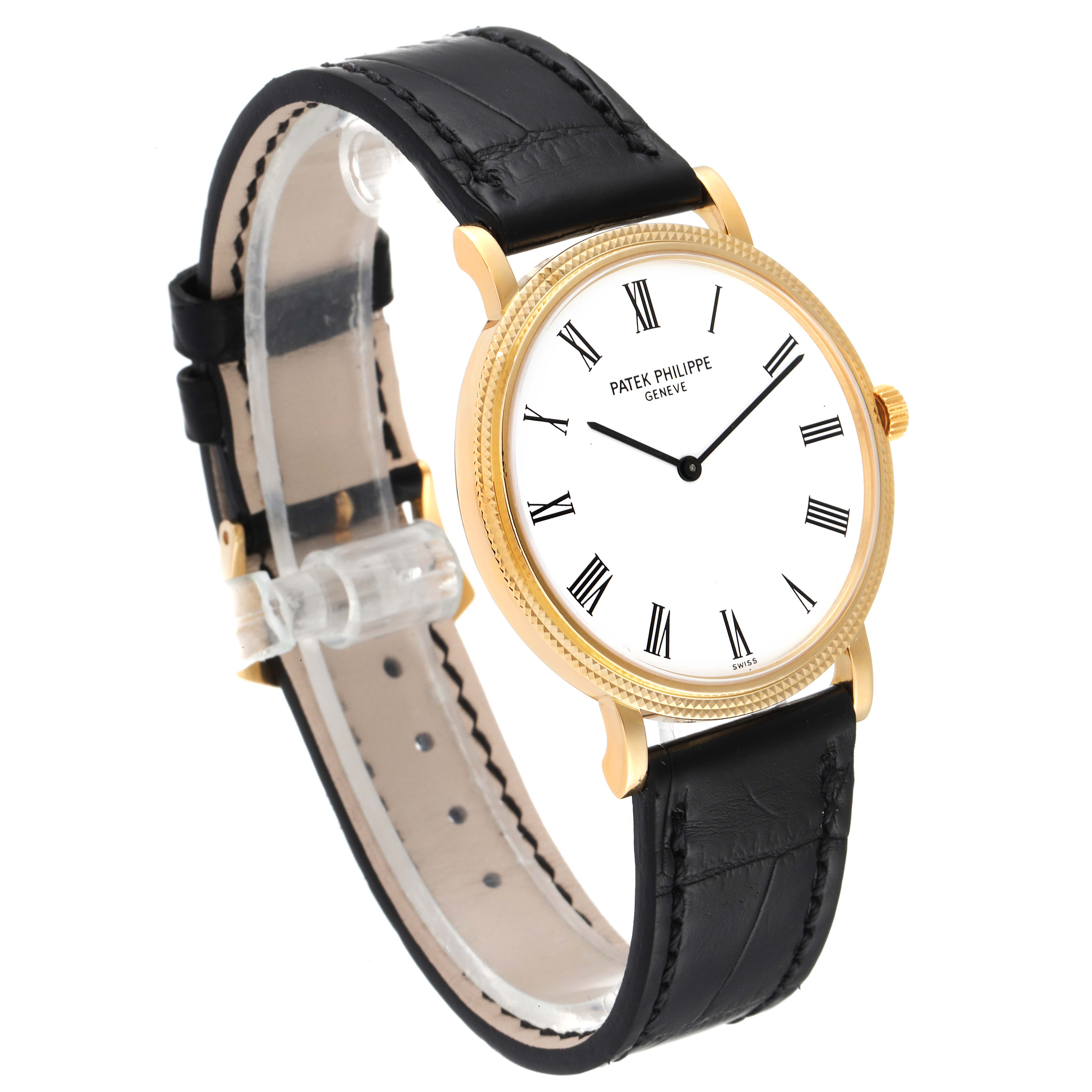 The Patek Philippe Calatrava 5120J Men's Yellow Gold White Dial 5120J Men's Yellow Gold White Dial watch is shown at an angle, highlighting its gold case, black leather strap, and white dial with Roman numerals.